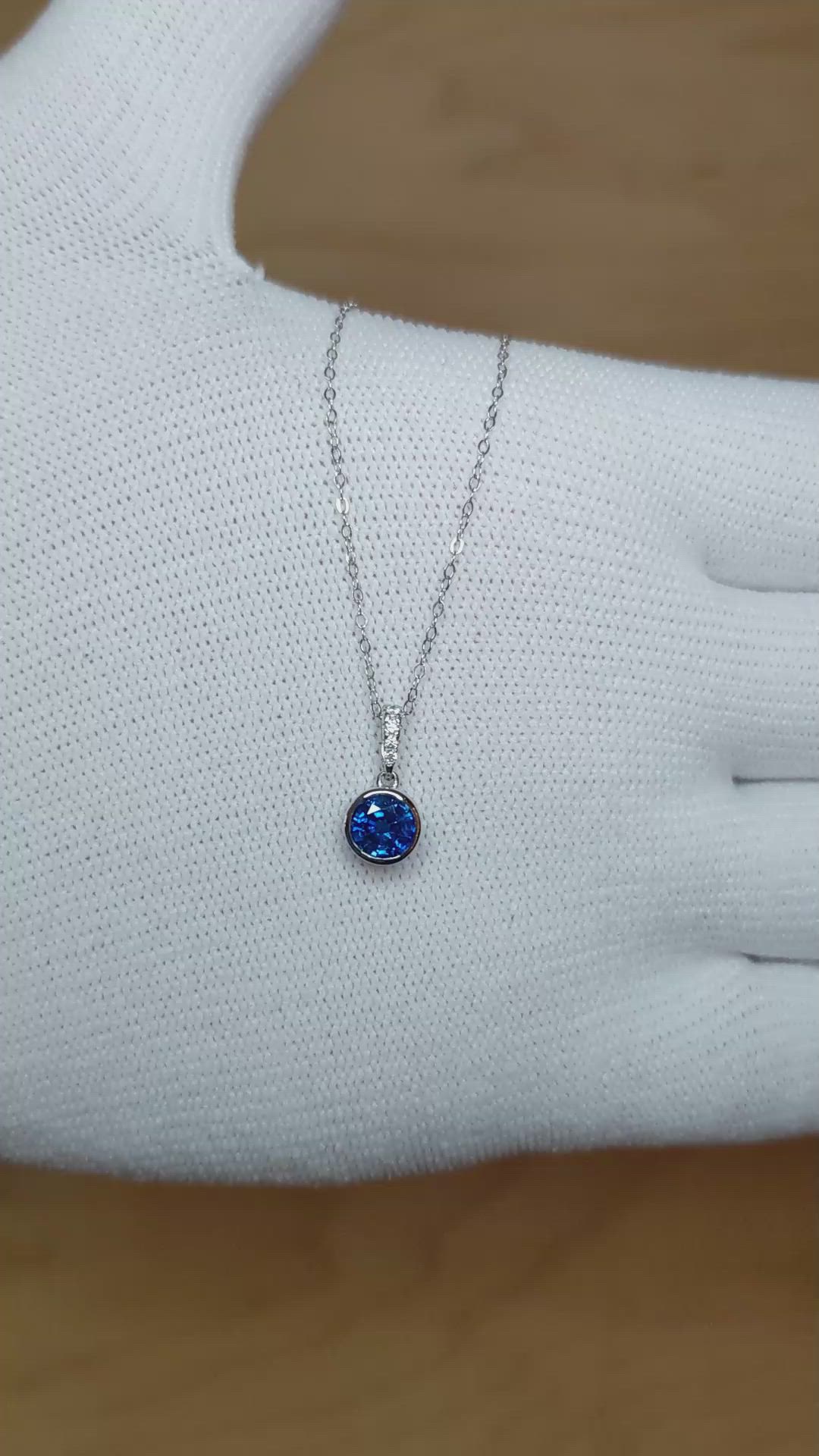 0.72 Ct. Blue Sapphire and Natural Diamond Bezel Pendant, 14K White Gold Size Video