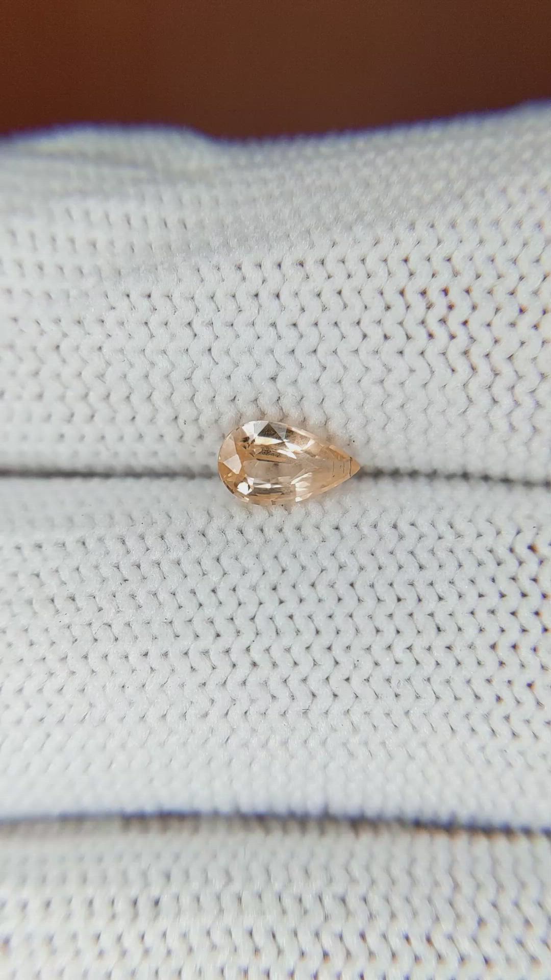 0.59 Ct. Peach Sapphire from Ceylon (Sri Lanka) Size Video