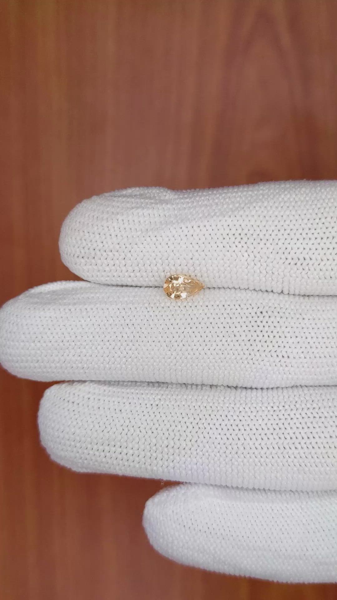 0.59 Ct. Peach Sapphire from Ceylon (Sri Lanka) Size Video