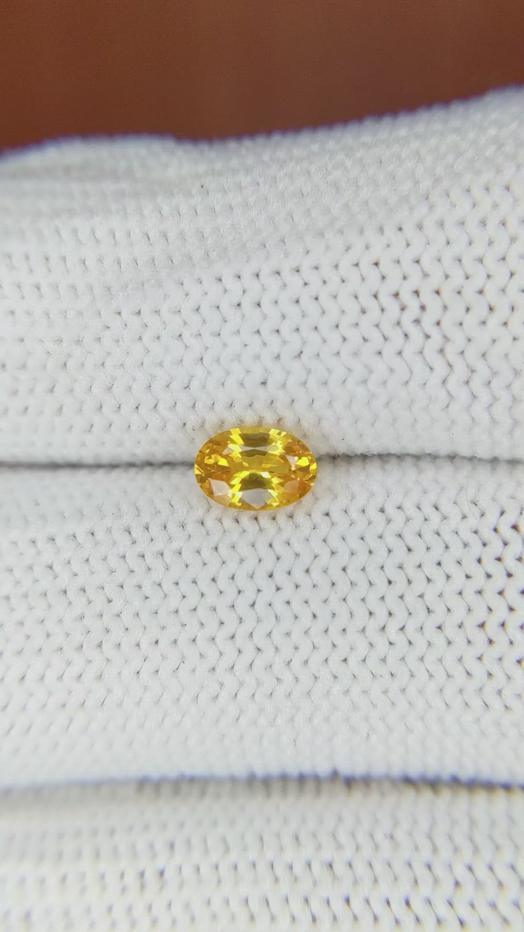 0.65 Ct. Orangish Yellow Sapphire from Ceylon (Sri Lanka) Size Video