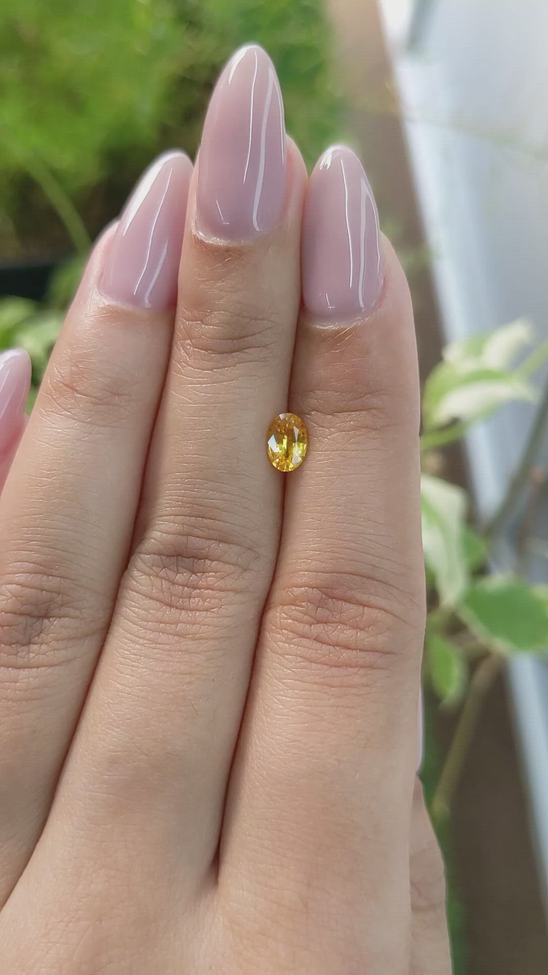 0.65 Ct. Orangish Yellow Sapphire from Ceylon (Sri Lanka) Size Video