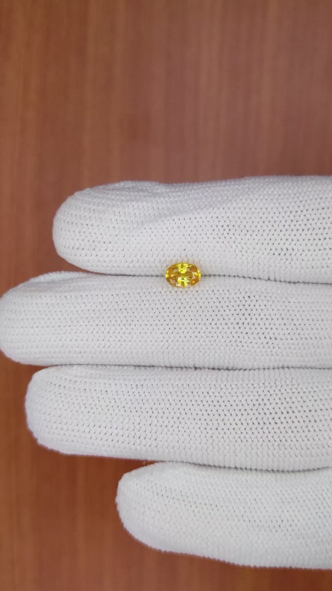 0.65 Ct. Orangish Yellow Sapphire from Ceylon (Sri Lanka) Size Video