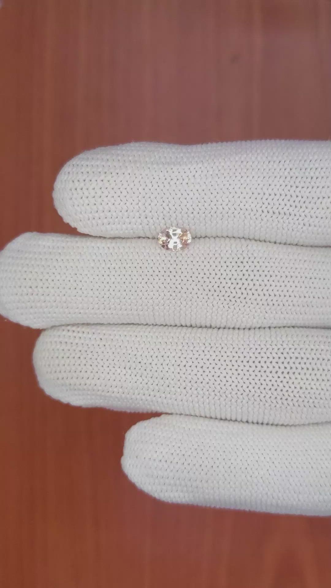 0.61 Ct. Peach Sapphire from Ceylon (Sri Lanka) Size Video