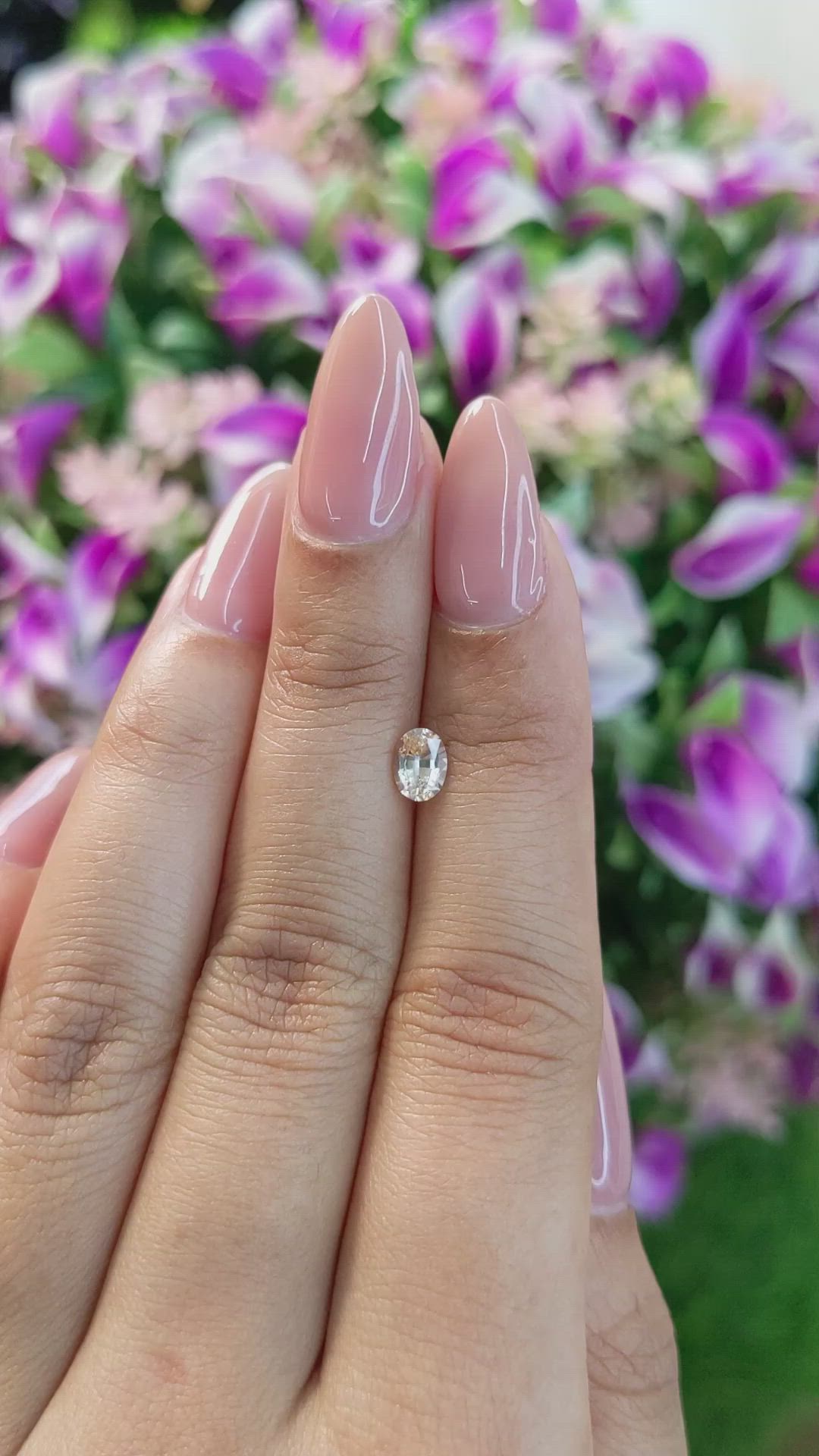 0.61 Ct. Peach Sapphire from Ceylon (Sri Lanka) Size Video