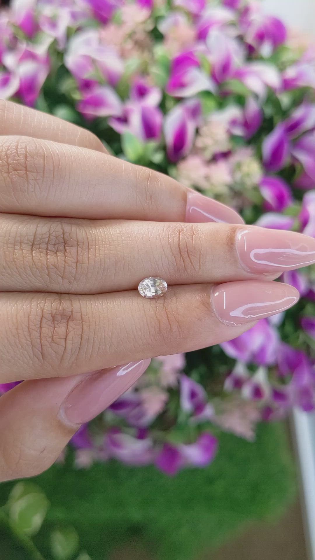 0.61 Ct. Peach Sapphire from Ceylon (Sri Lanka) Size Video