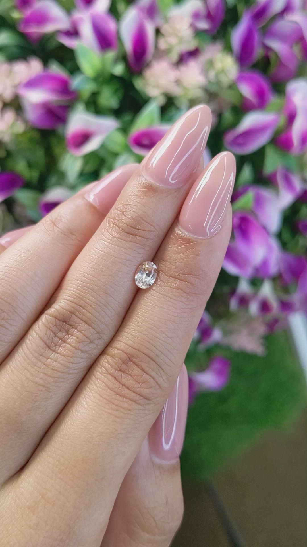 0.61 Ct. Peach Sapphire from Ceylon (Sri Lanka) Size Video