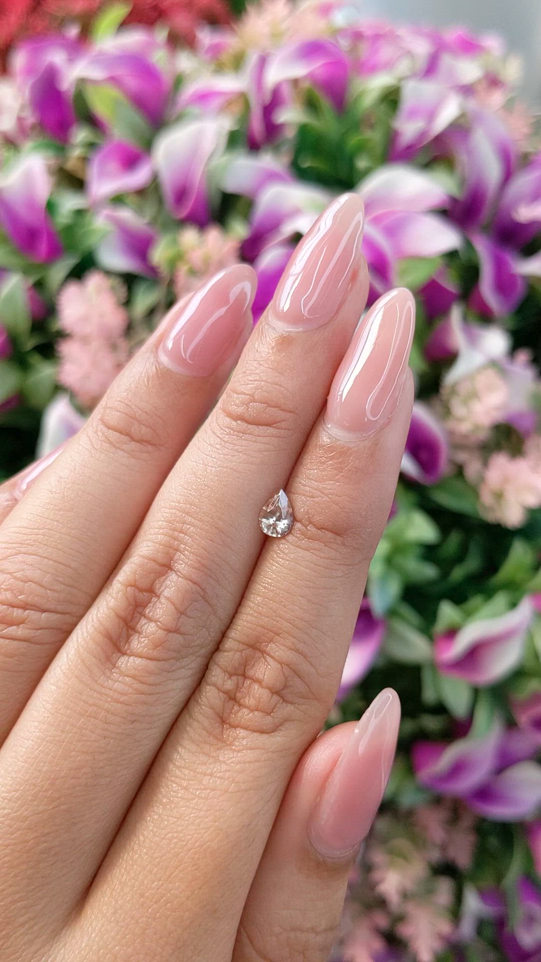 0.57 Ct. Peach Sapphire from Ceylon (Sri Lanka) Size Video