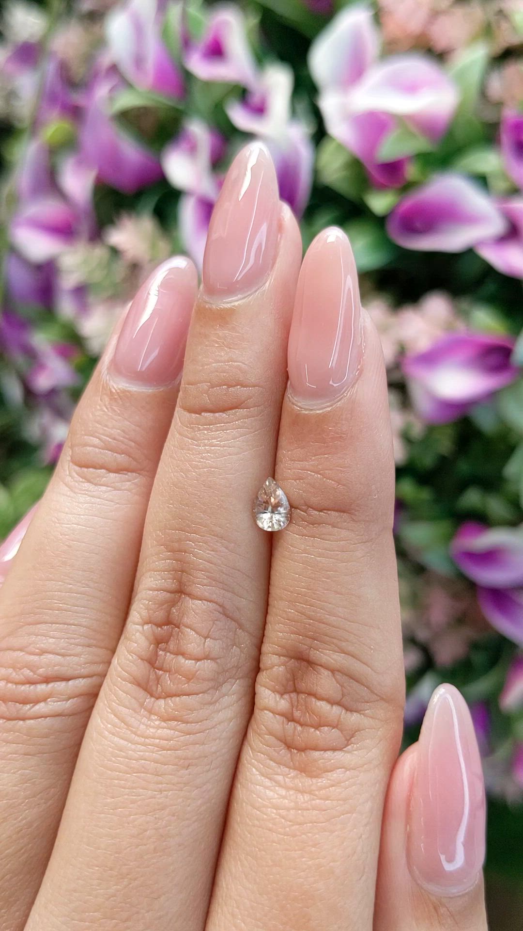 0.57 Ct. Peach Sapphire from Ceylon (Sri Lanka) Size Video