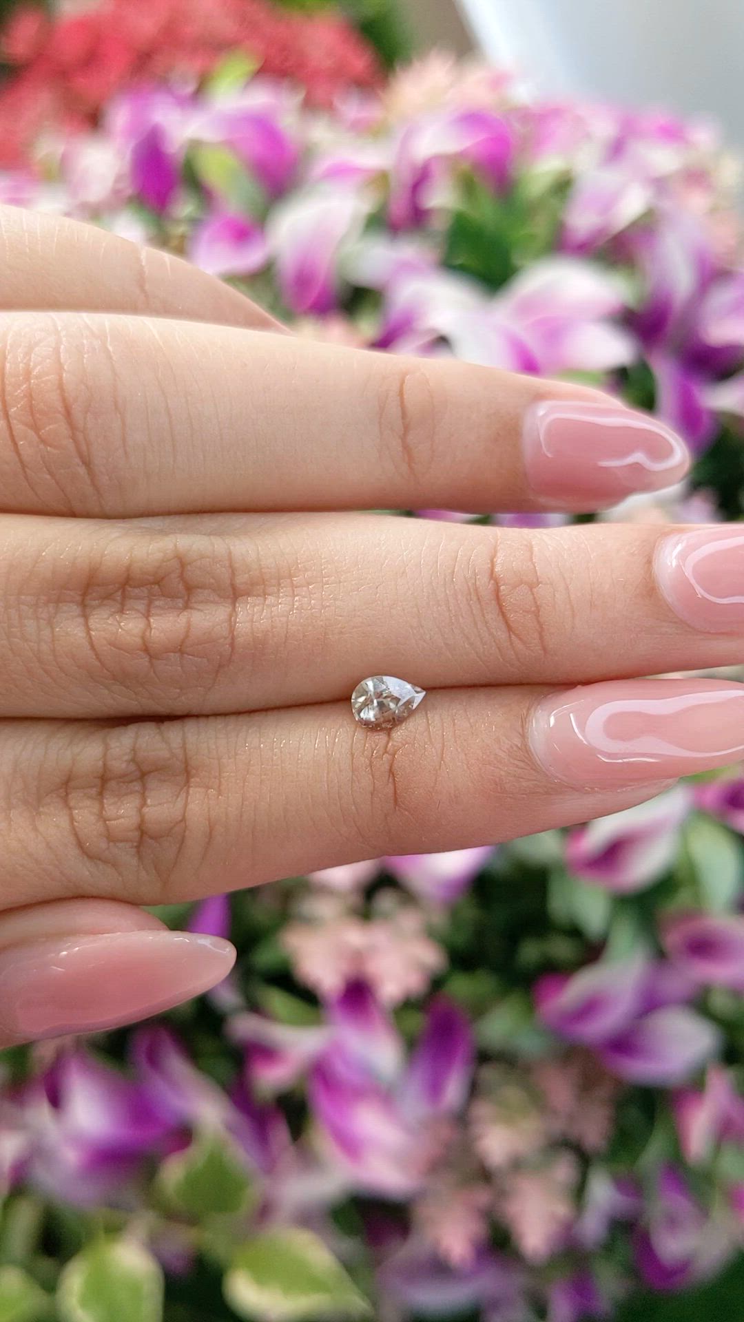 0.57 Ct. Peach Sapphire from Ceylon (Sri Lanka) Size Video