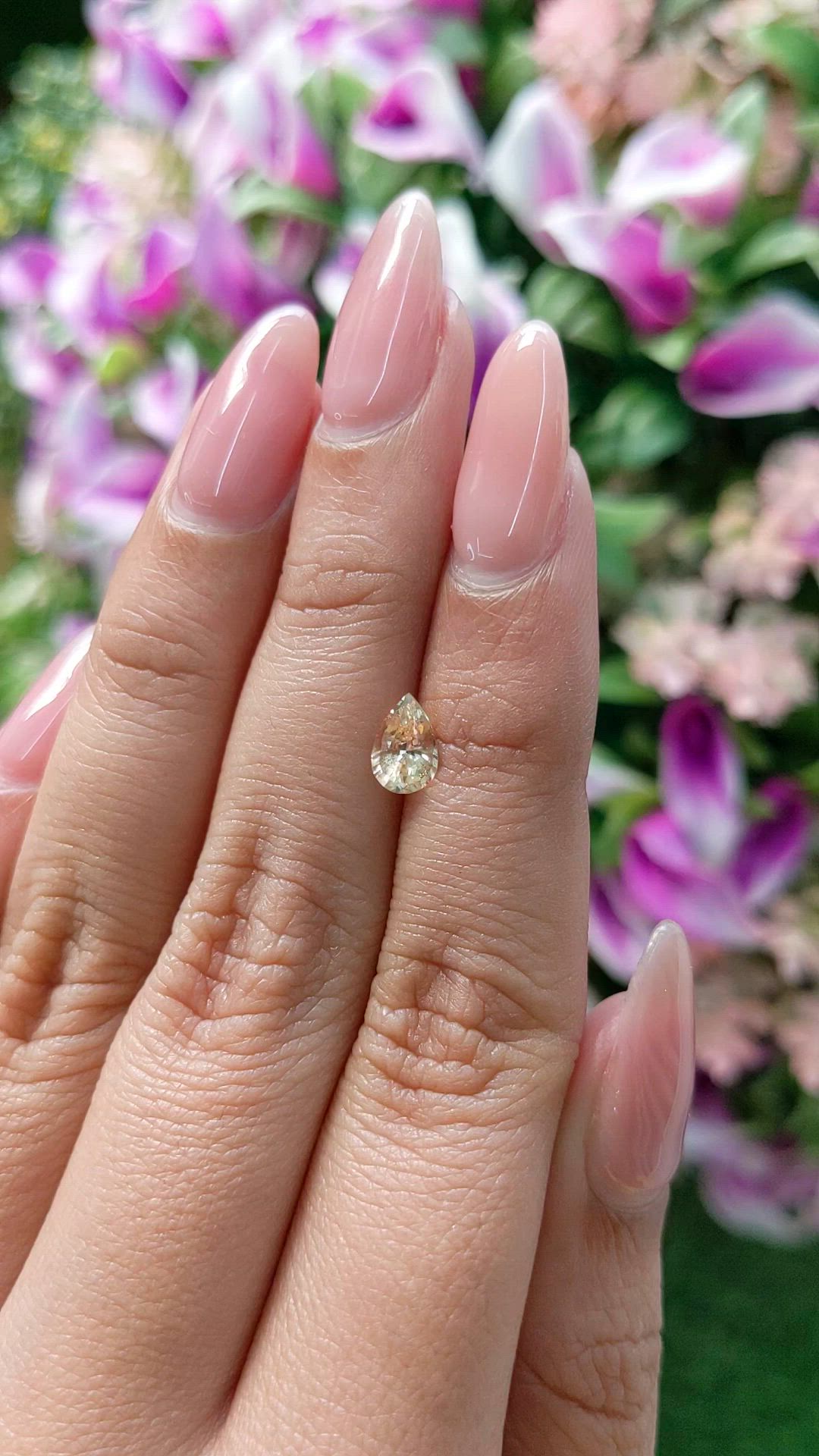 0.88 Ct. Peach Sapphire from Ceylon (Sri Lanka) Size Video