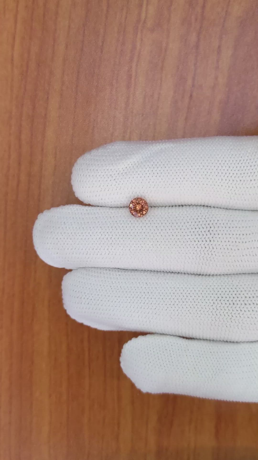 0.68 Ct. Orange Sapphire from Ceylon (Sri Lanka) Size Video