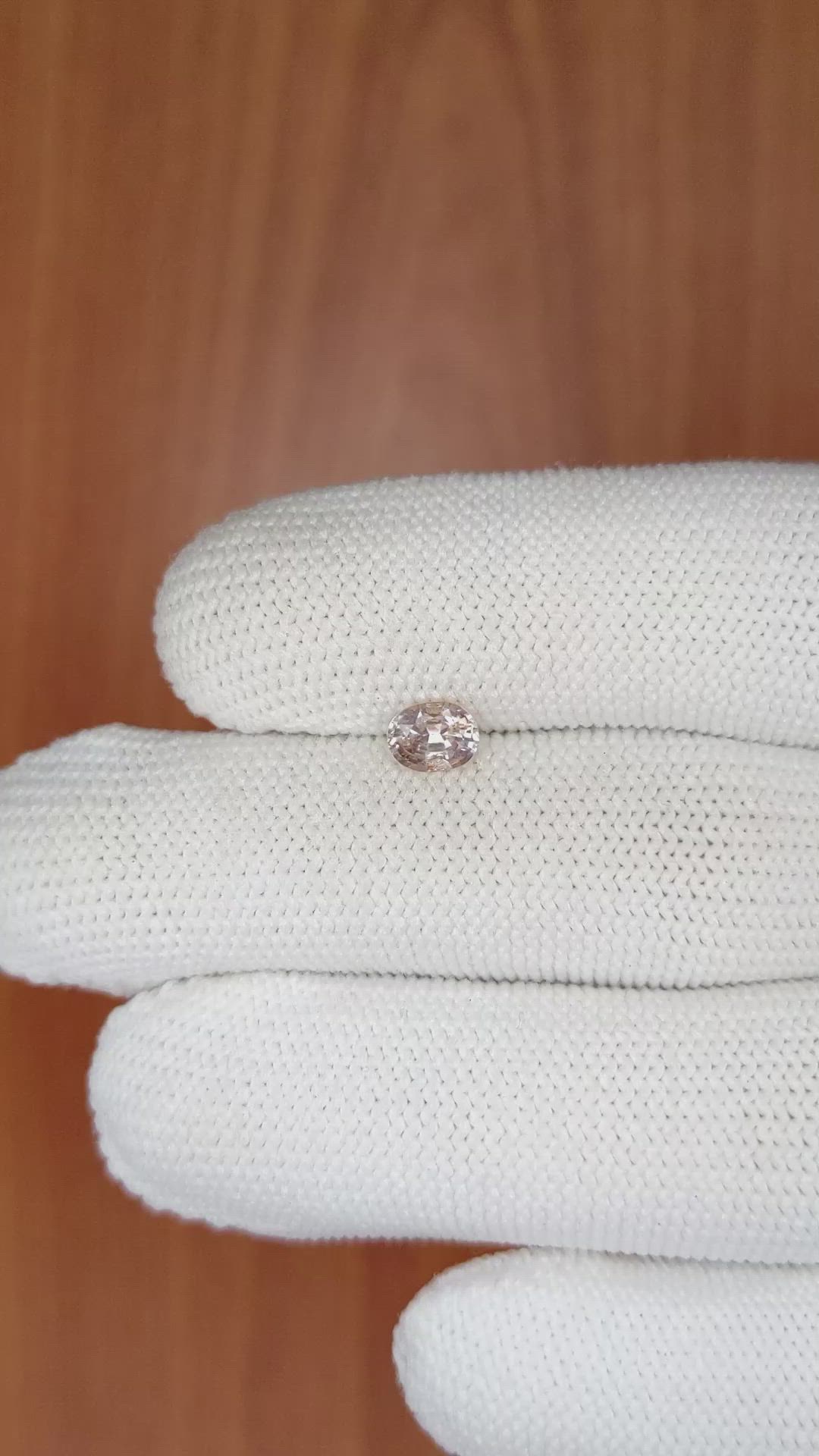 0.67 Ct. Peach Sapphire from Ceylon (Sri Lanka) Size Video