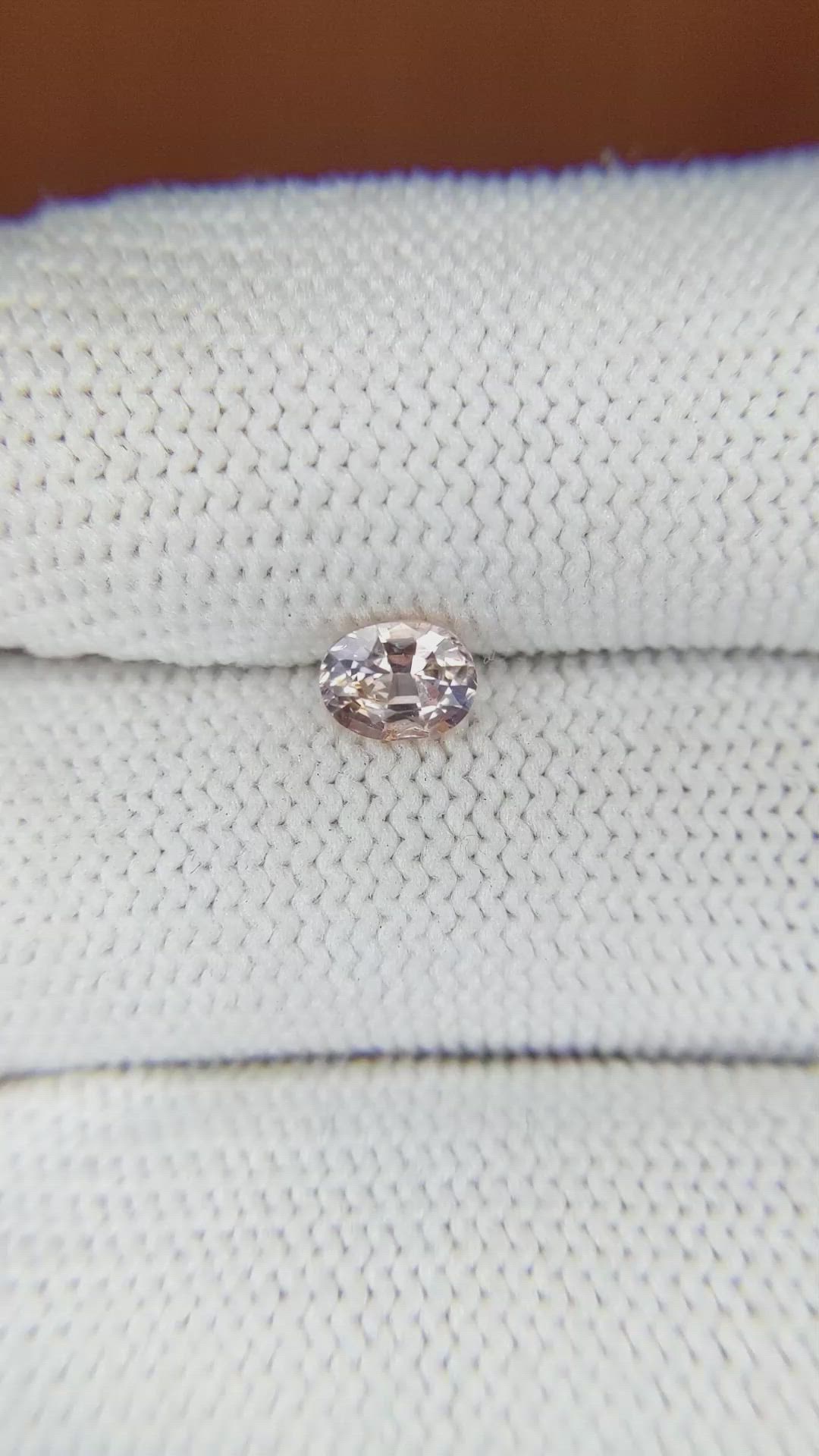 0.67 Ct. Peach Sapphire from Ceylon (Sri Lanka) Size Video