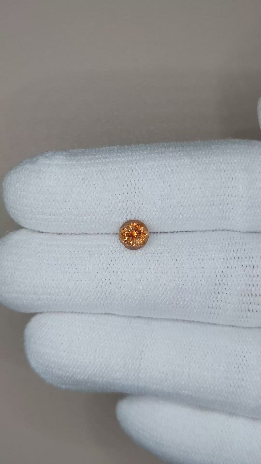 0.71 Ct. Orange Sapphire from Montana Size Video