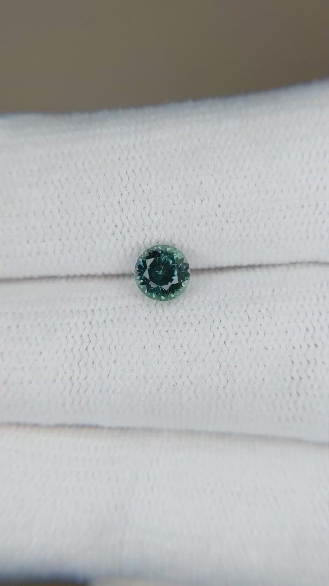 0.66 Ct. Bluish Green Sapphire from Montana Size Video