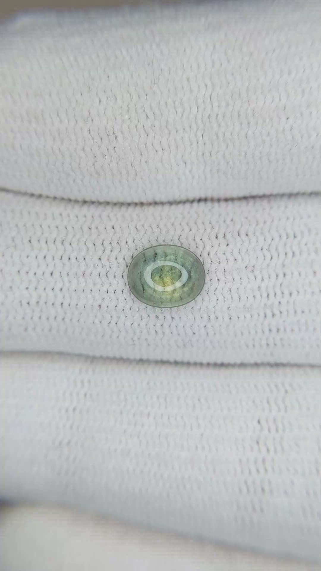 0.87 Ct. Yellowish Green Cabochon Sapphire from Montana Size Video