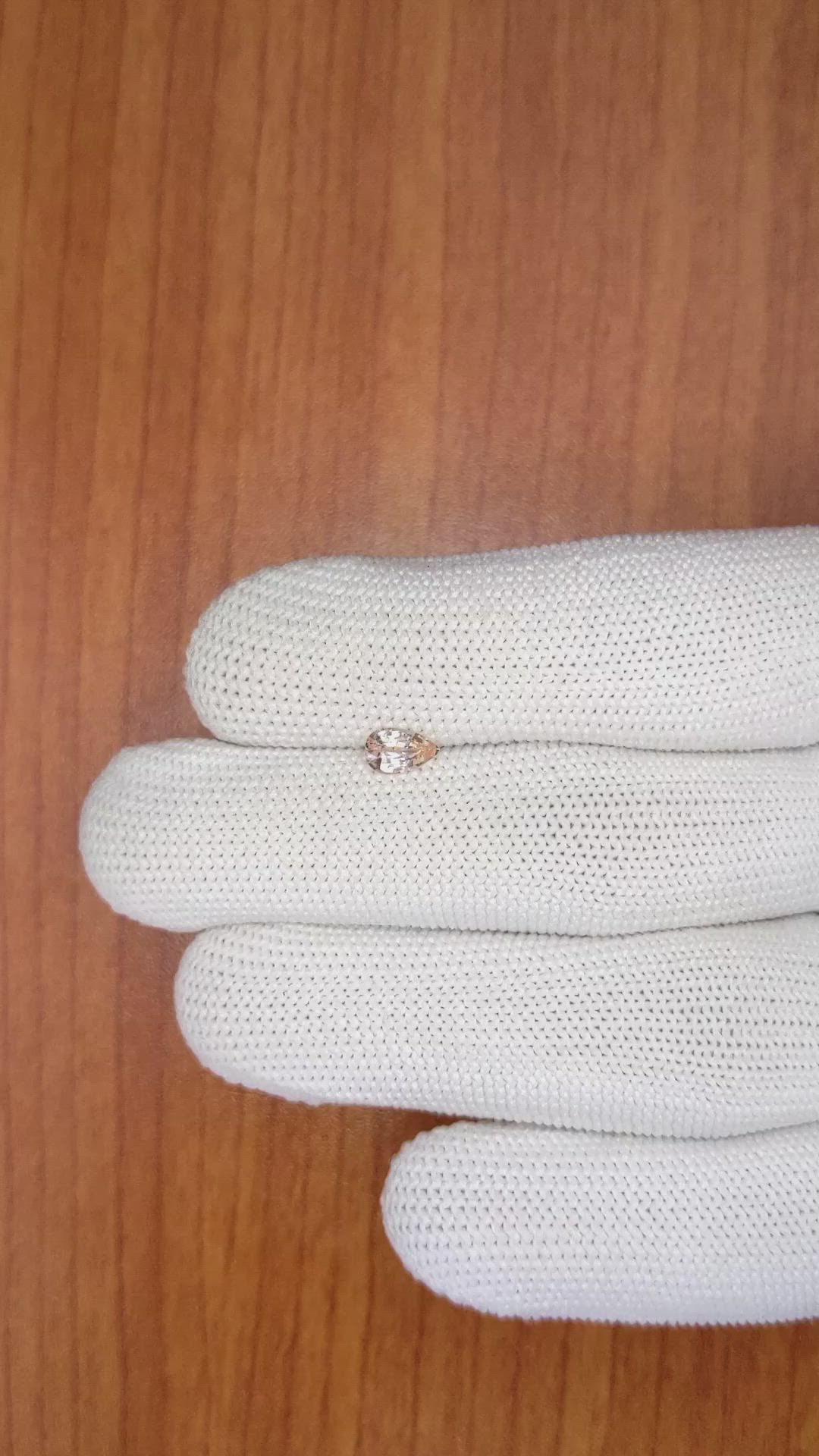 0.57 Ct. Peach Sapphire from Ceylon (Sri Lanka) Size Video