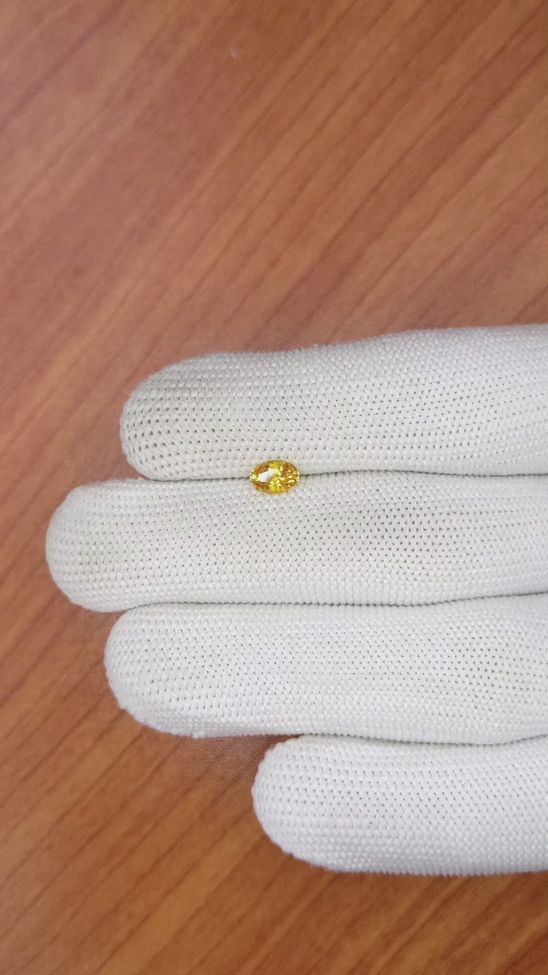 0.59 Ct. Orangish Yellow Sapphire from Ceylon (Sri Lanka) Size Video