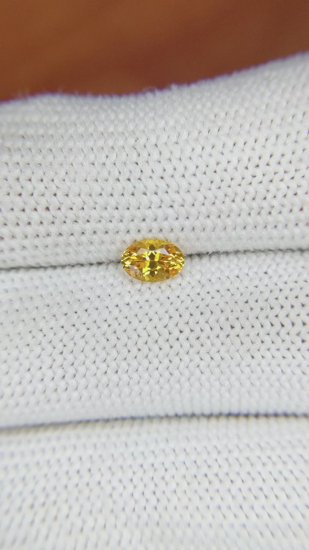 0.59 Ct. Orangish Yellow Sapphire from Ceylon (Sri Lanka) Size Video