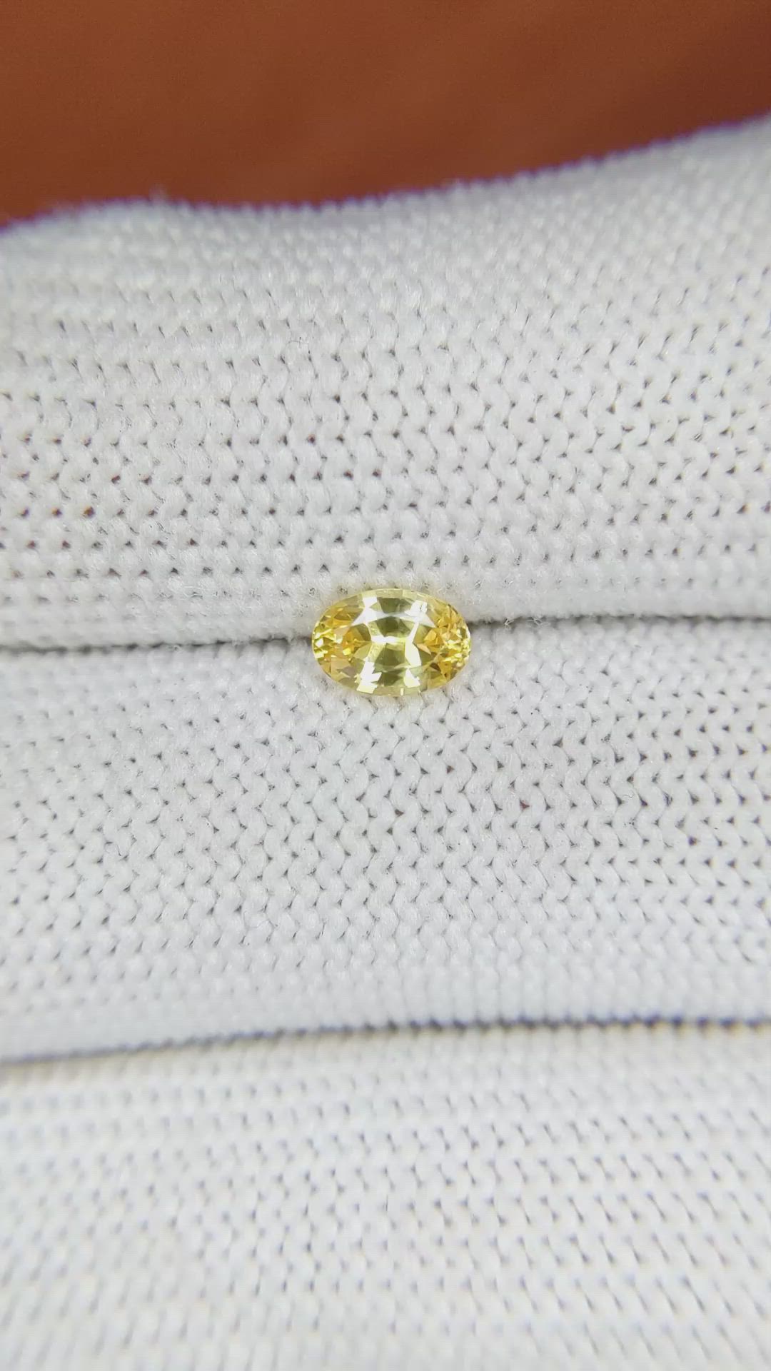 0.60 Ct. Orangish Yellow Sapphire from Ceylon (Sri Lanka) Size Video
