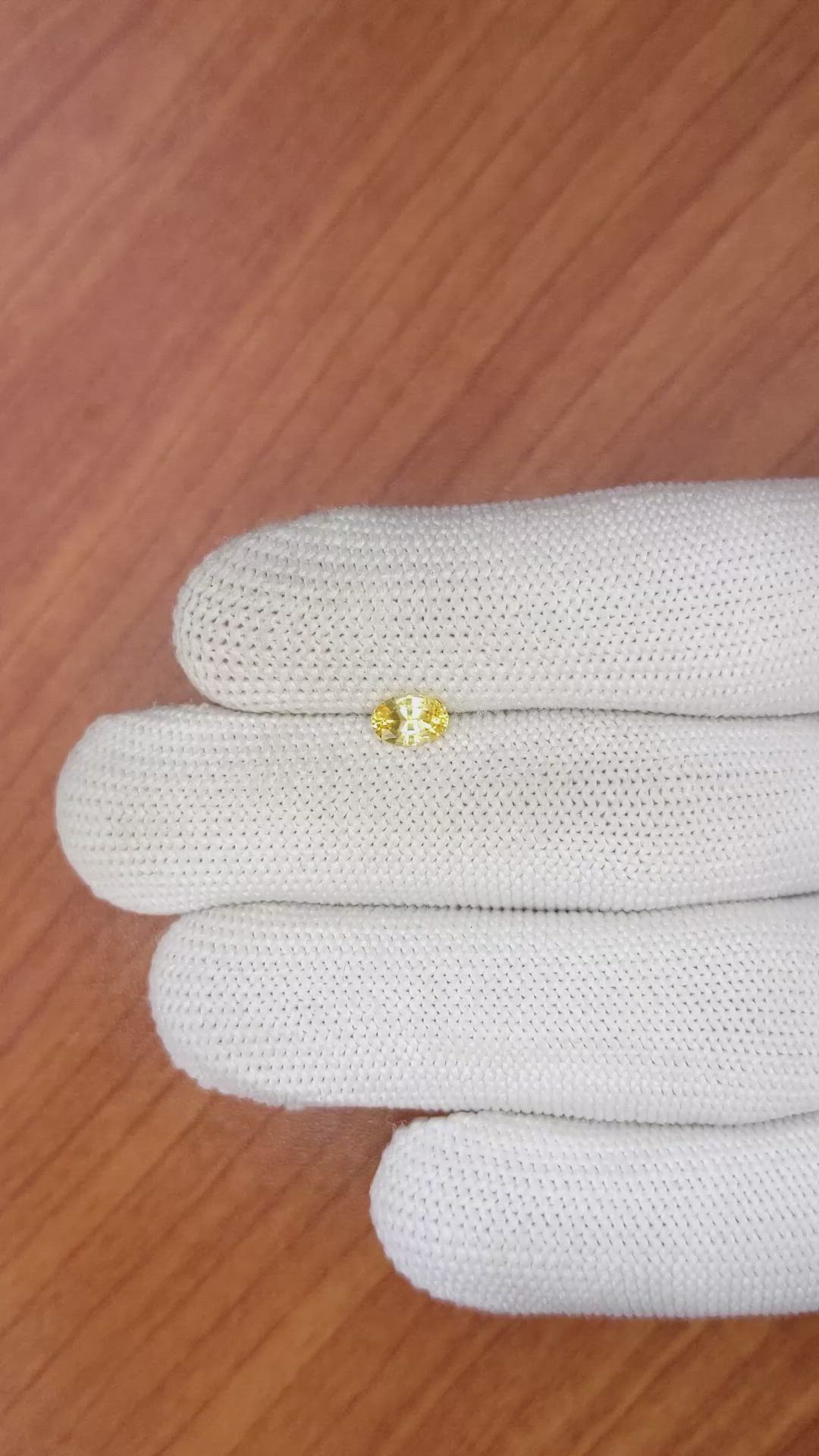 0.60 Ct. Orangish Yellow Sapphire from Ceylon (Sri Lanka) Size Video