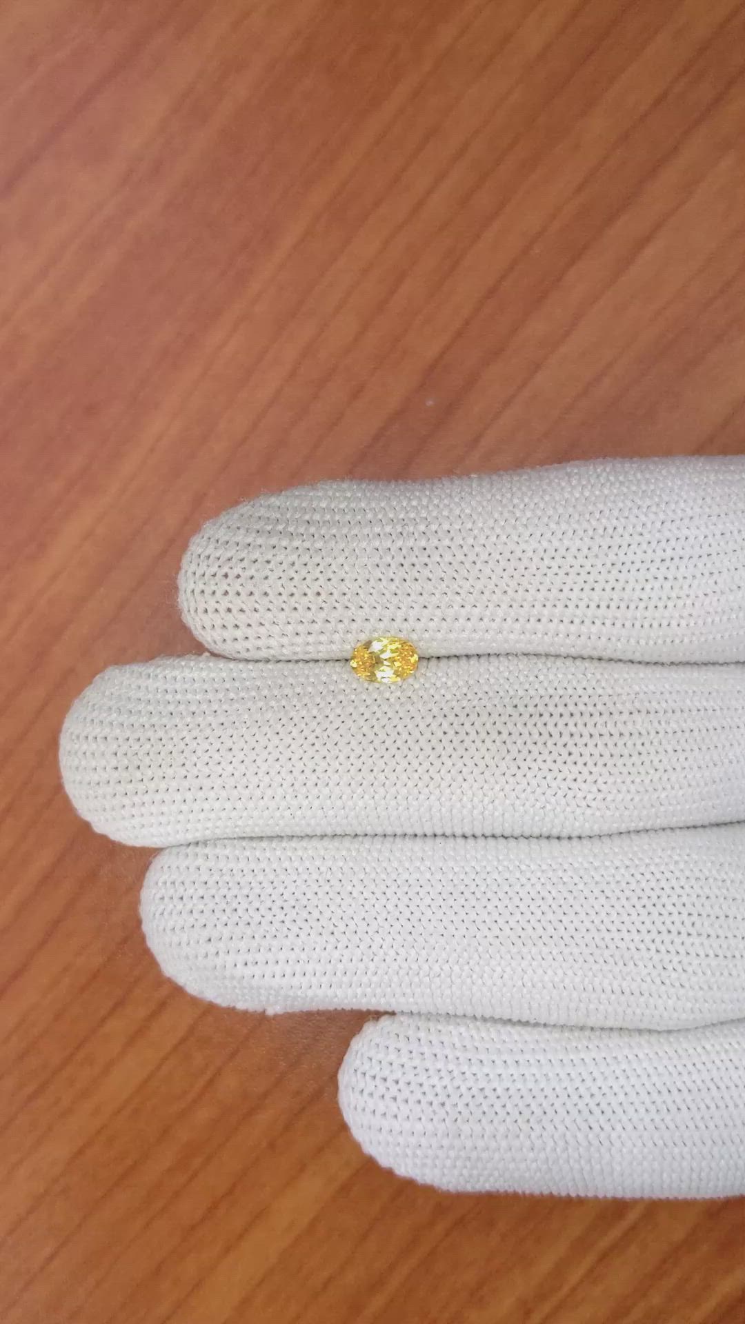 0.45 Ct. Orangish Yellow Sapphire from Ceylon (Sri Lanka) Size Video