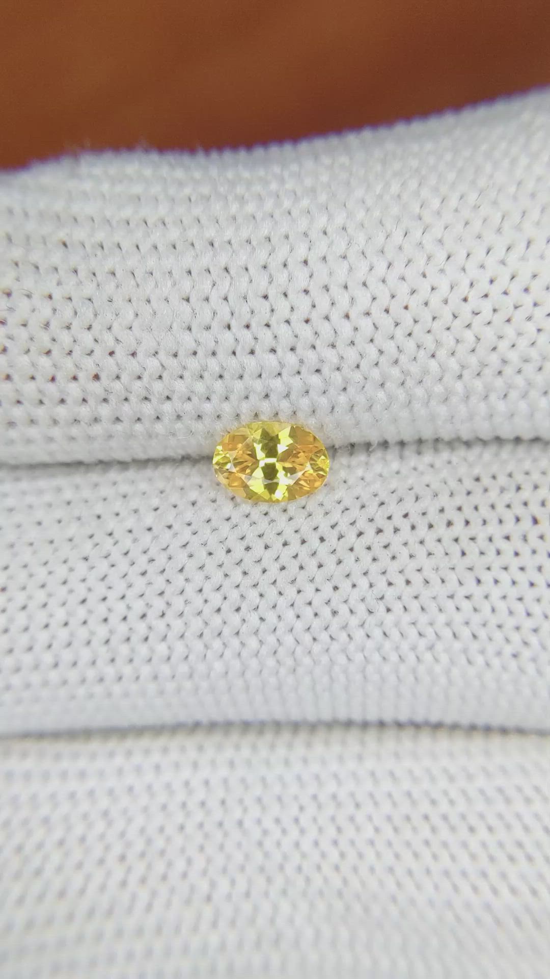 0.60 Ct. Orangish Yellow Sapphire from Ceylon (Sri Lanka) Size Video