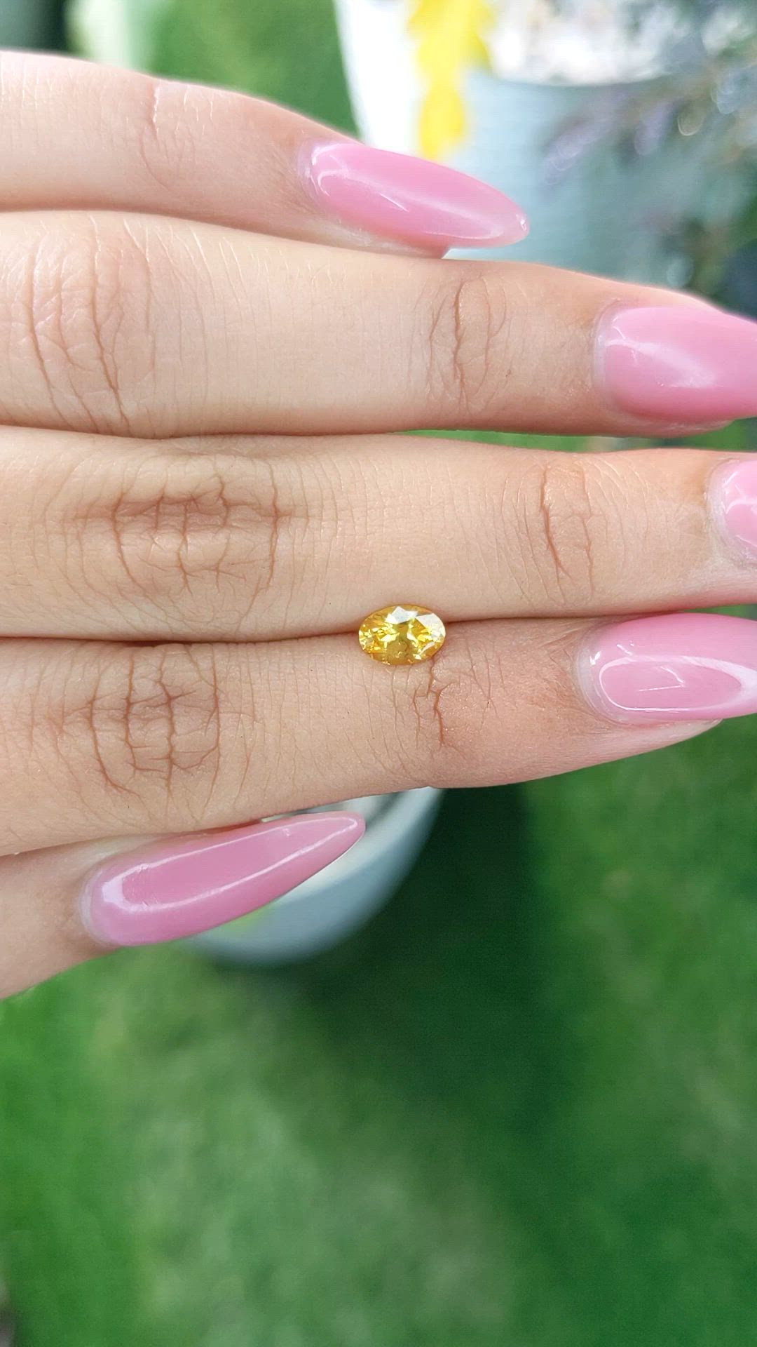 0.60 Ct. Orangish Yellow Sapphire from Ceylon (Sri Lanka) Size Video