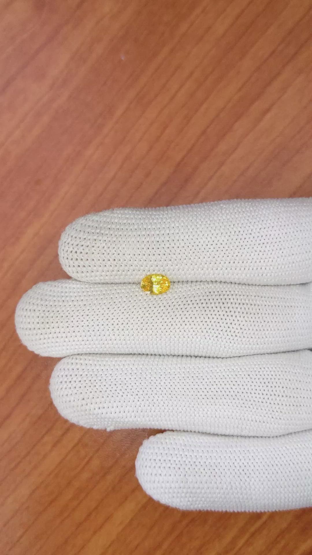 0.60 Ct. Orangish Yellow Sapphire from Ceylon (Sri Lanka) Size Video
