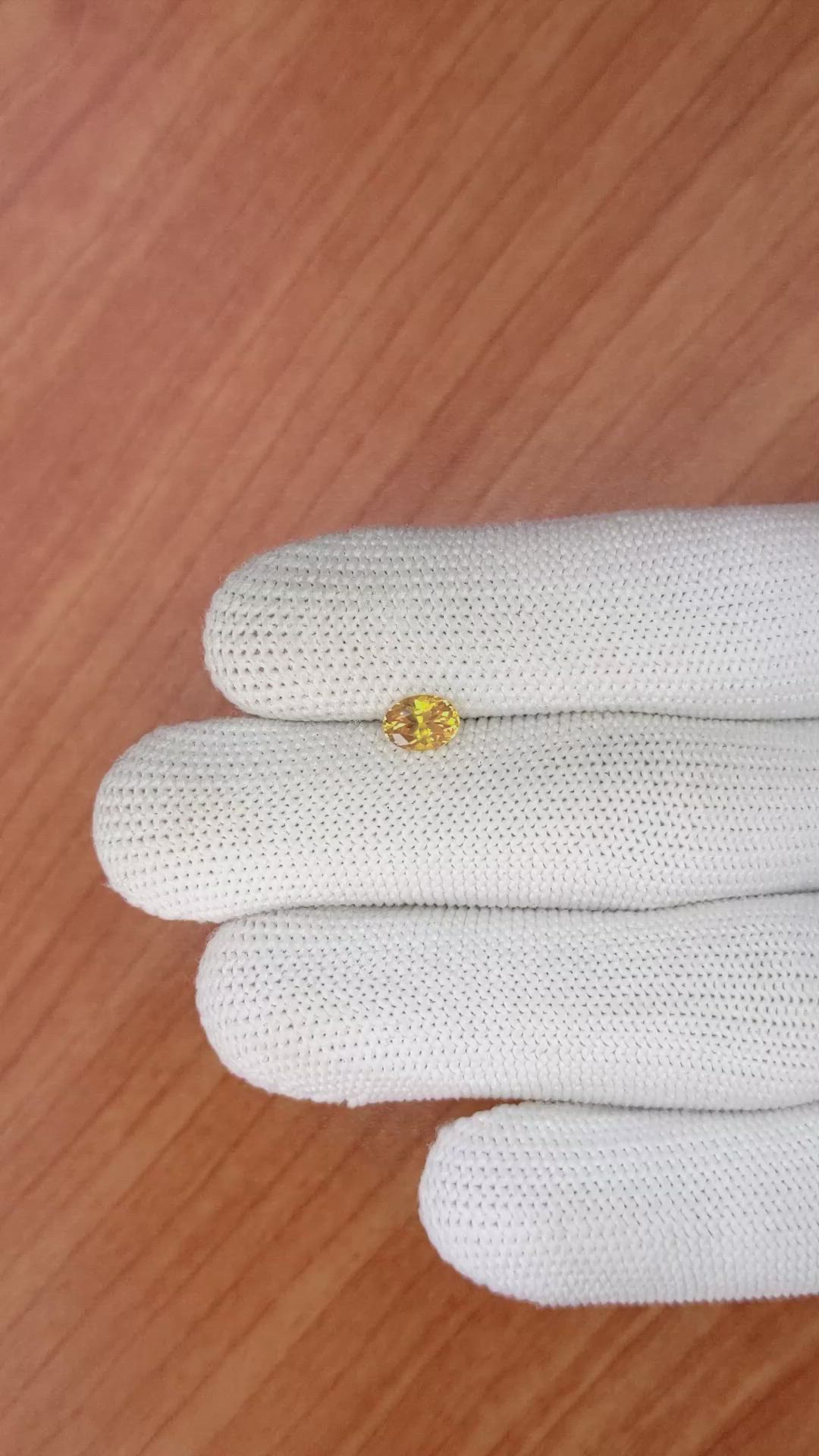 0.75 Ct. Yellowish Orange Sapphire from Ceylon (Sri Lanka) Size Video
