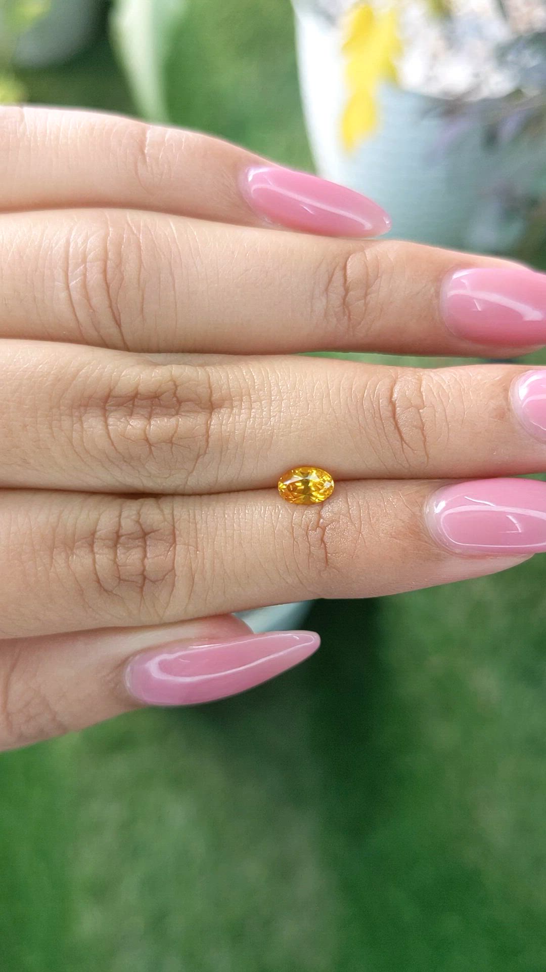 0.60 Ct. Yellowish Orange Sapphire from Ceylon (Sri Lanka) Size Video