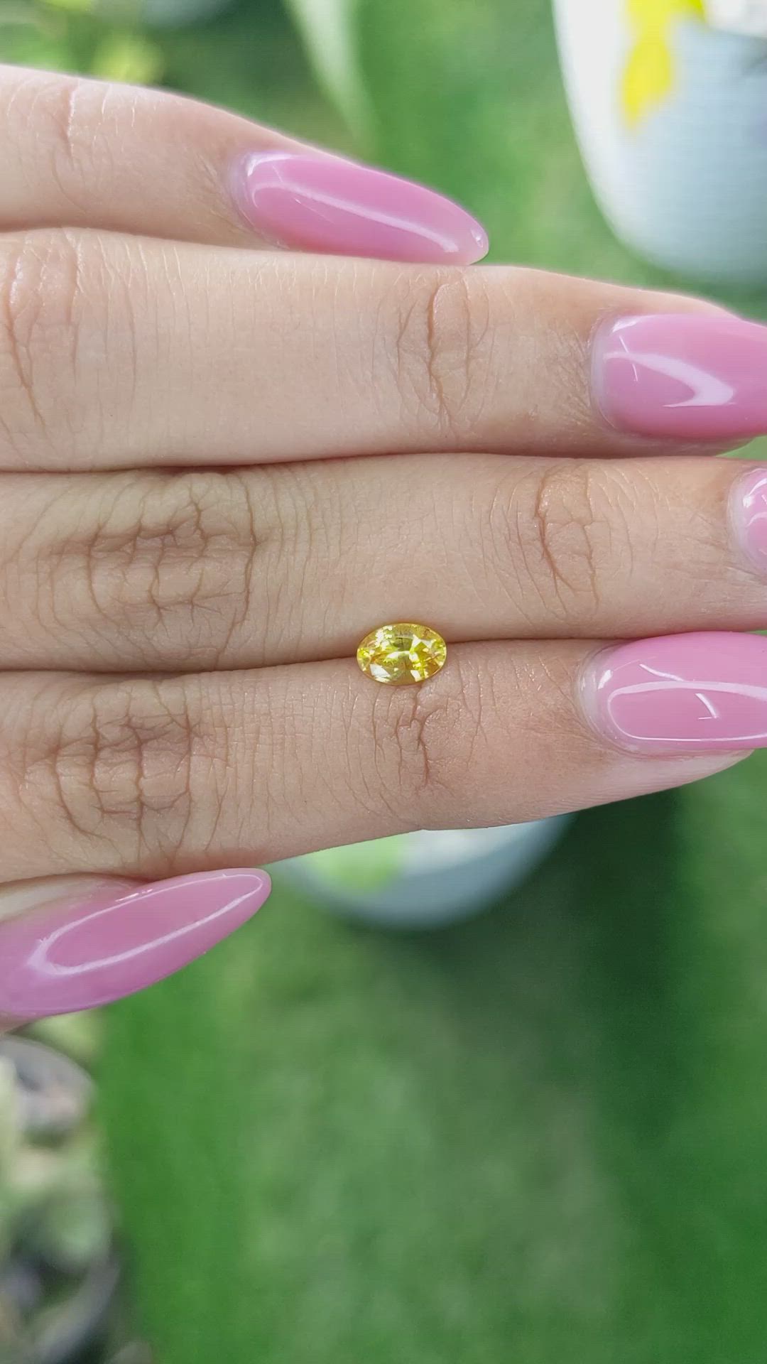 0.58 Ct. Orangish Yellow Sapphire from Ceylon (Sri Lanka) Size Video