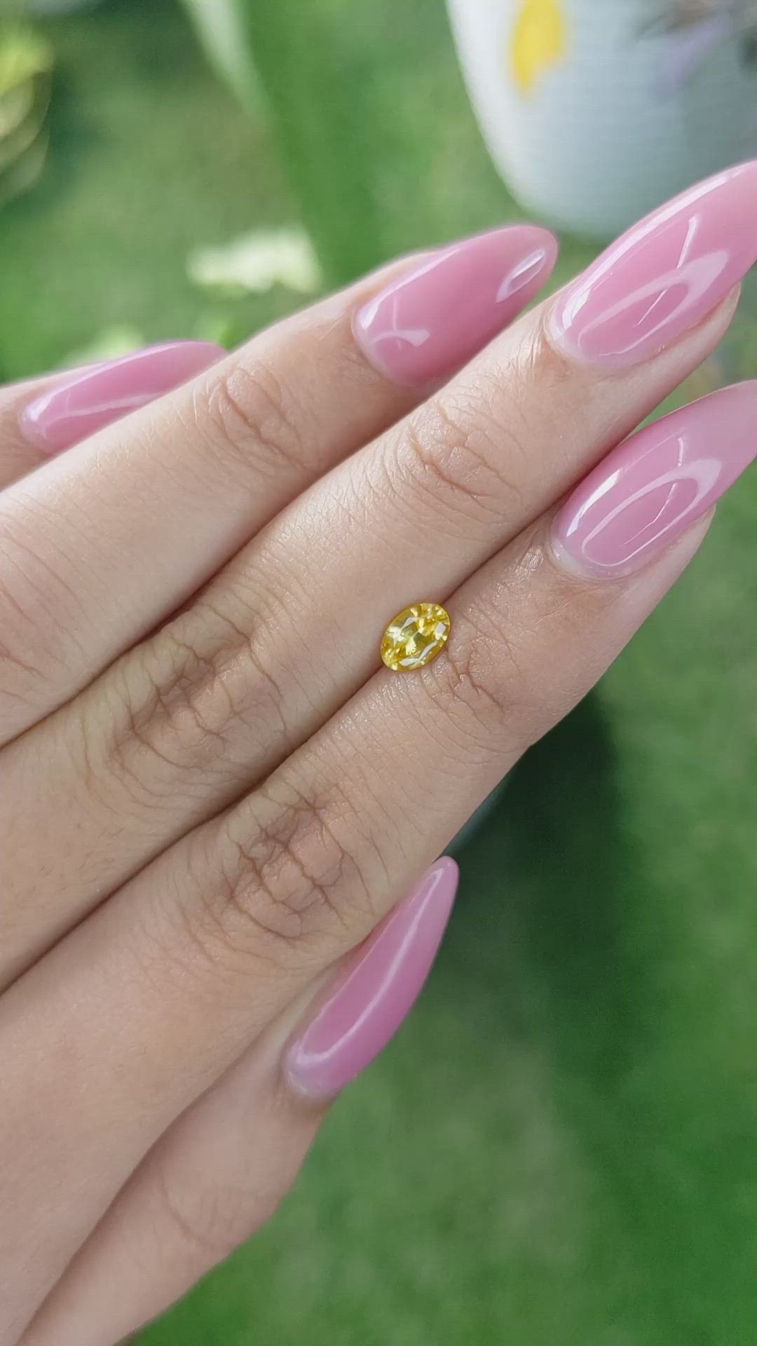0.58 Ct. Orangish Yellow Sapphire from Ceylon (Sri Lanka) Size Video