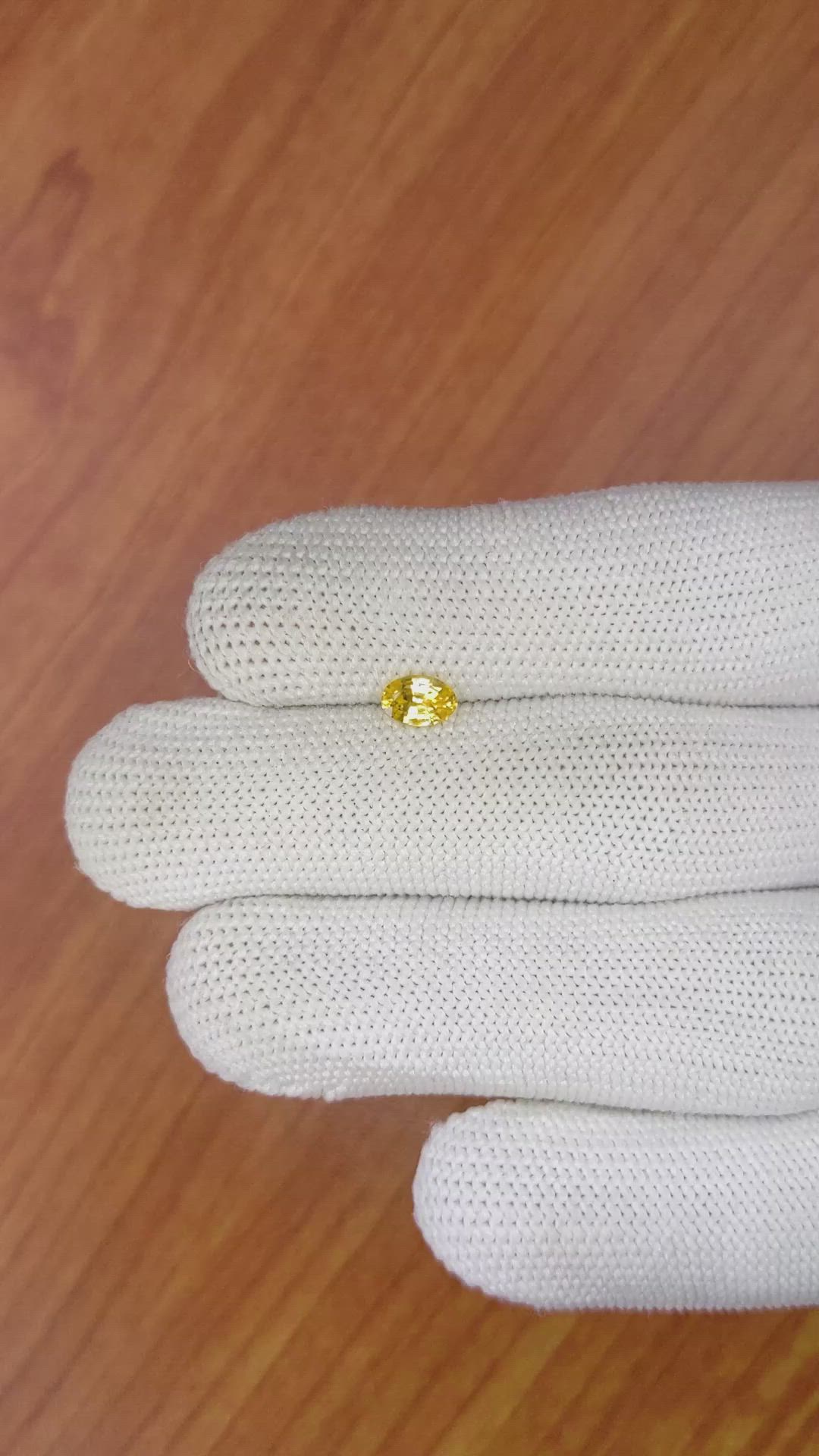 0.58 Ct. Orangish Yellow Sapphire from Ceylon (Sri Lanka) Size Video