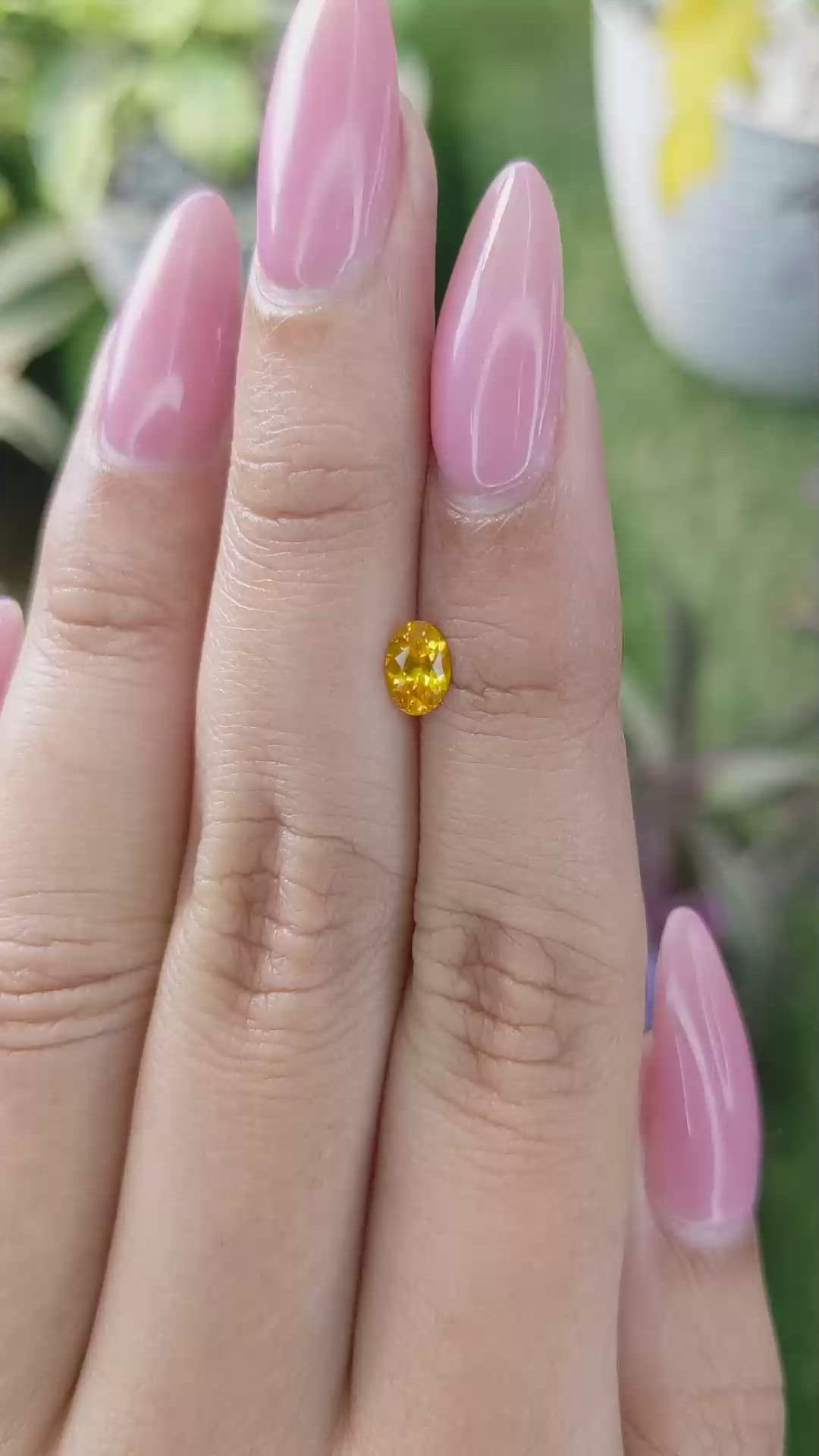 0.55 Ct. Yellowish Orange Sapphire from Ceylon (Sri Lanka) Size Video