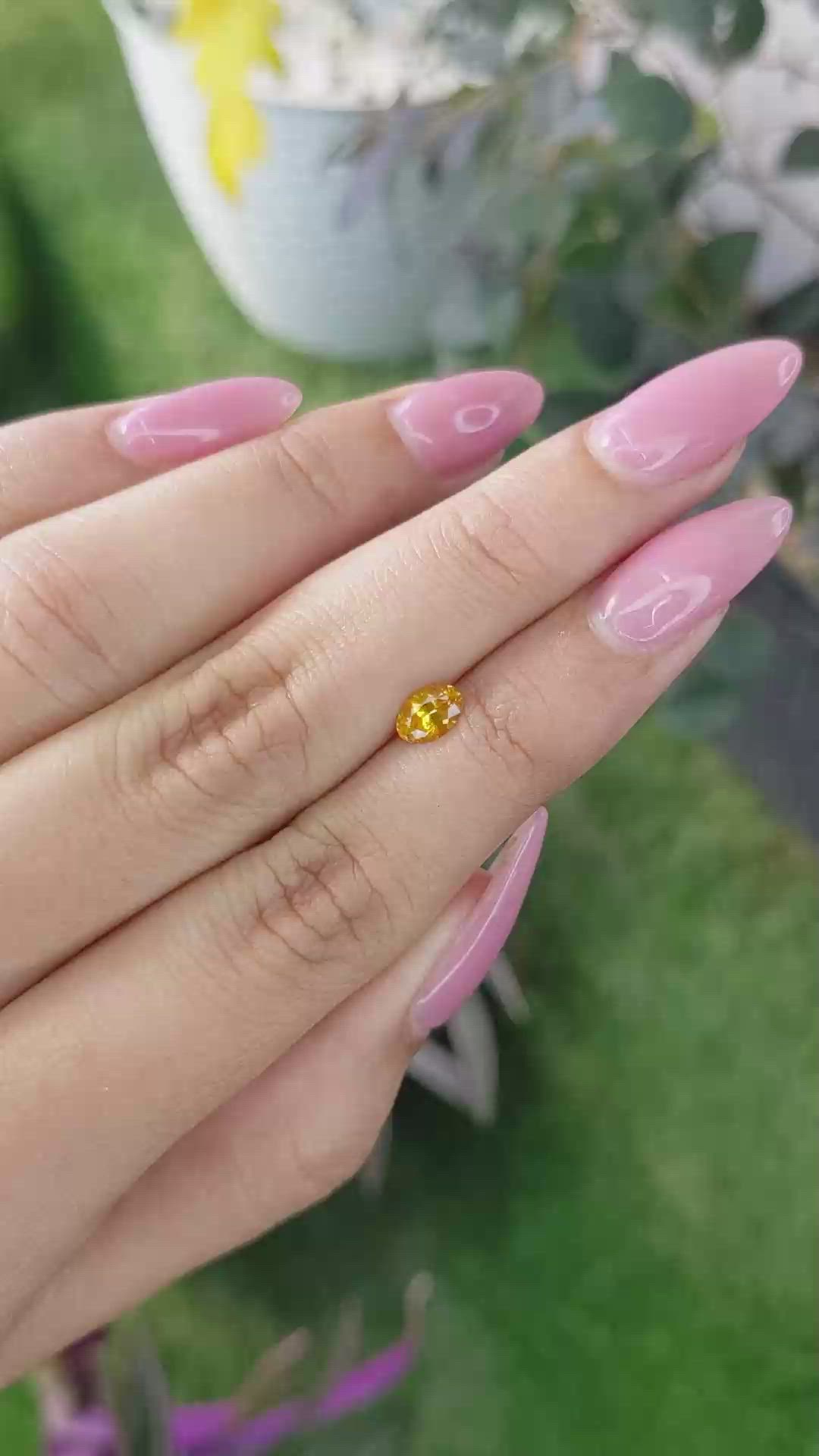 0.53 Ct. Yellowish Orange Sapphire from Ceylon (Sri Lanka) Size Video