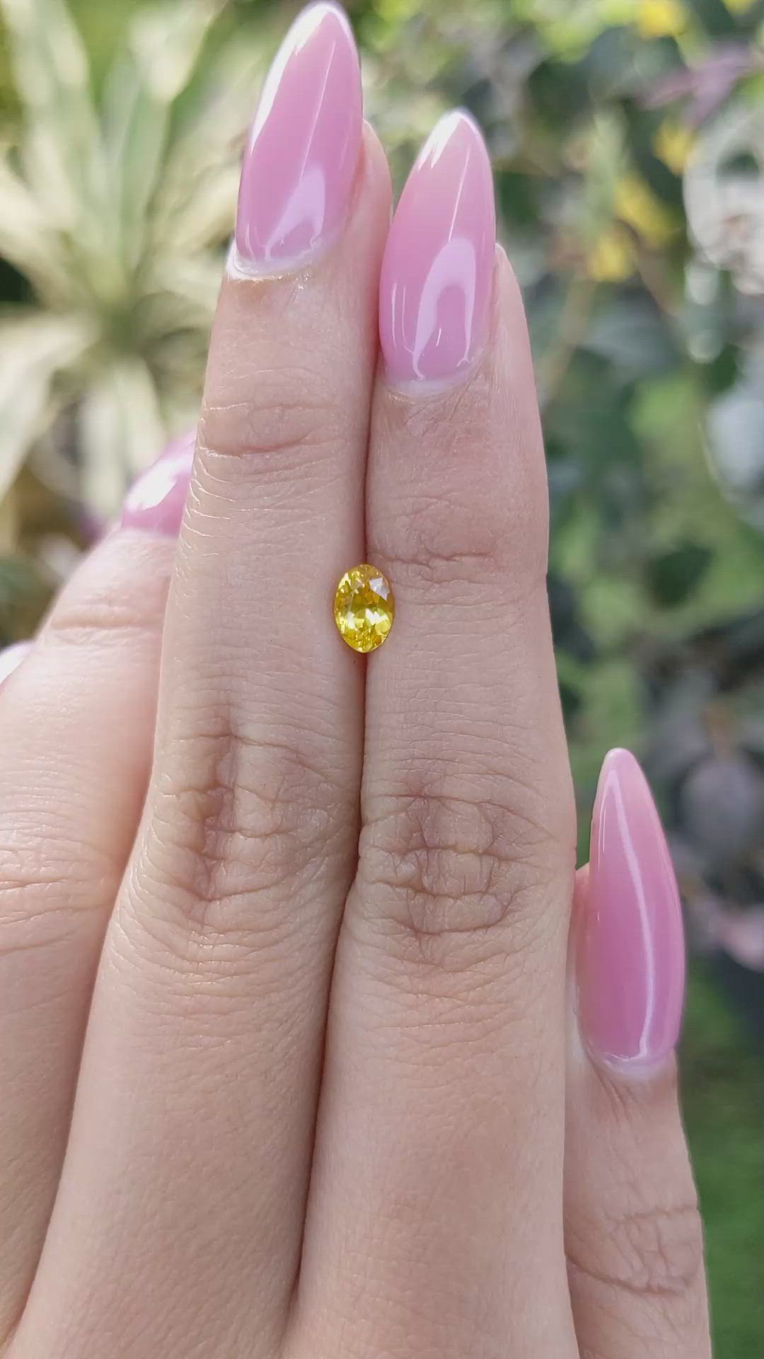 0.60 Ct. Orangish Yellow Sapphire from Ceylon (Sri Lanka) Size Video