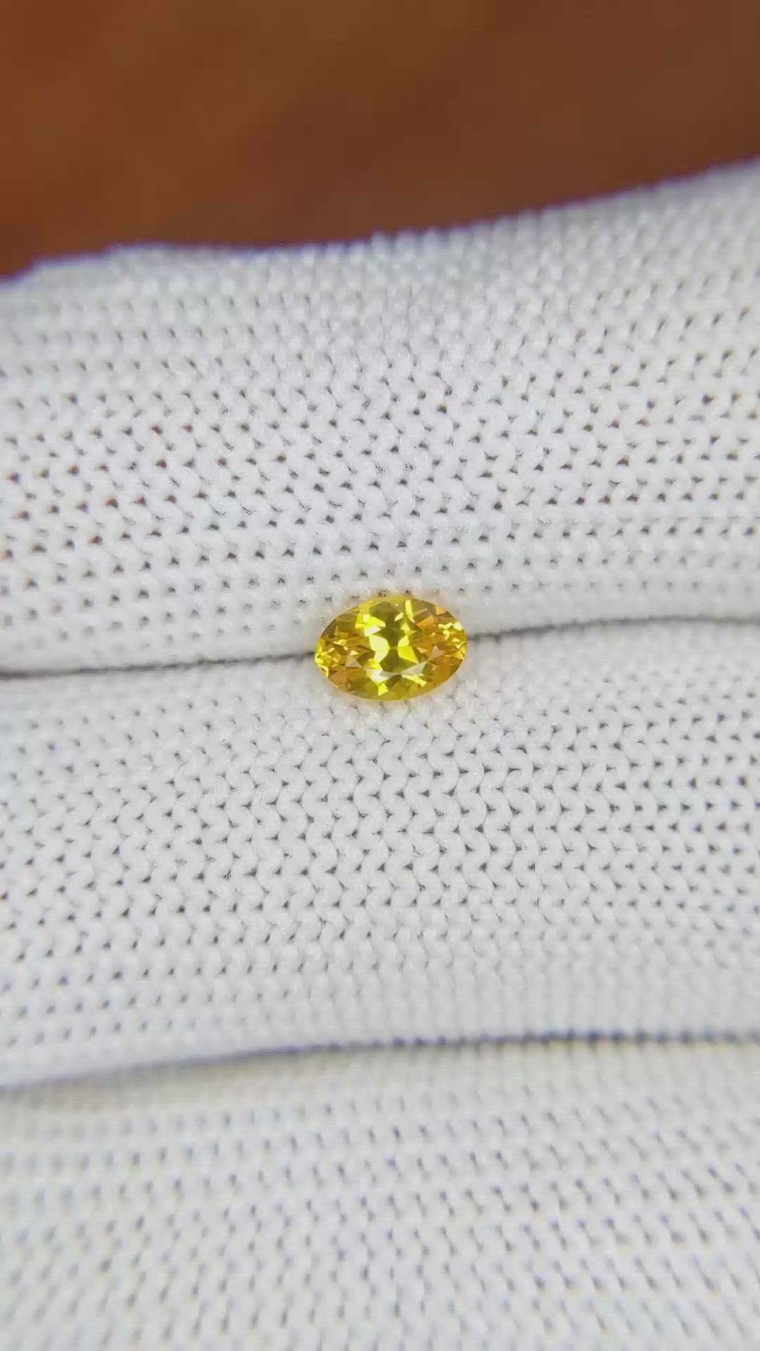 0.60 Ct. Orangish Yellow Sapphire from Ceylon (Sri Lanka) Size Video
