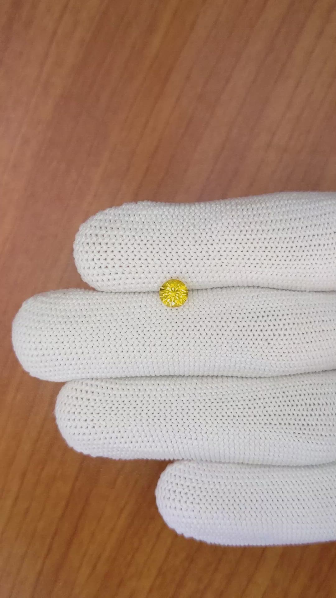 0.66 Ct. Orangish Yellow Sapphire from Ceylon (Sri Lanka) Size Video