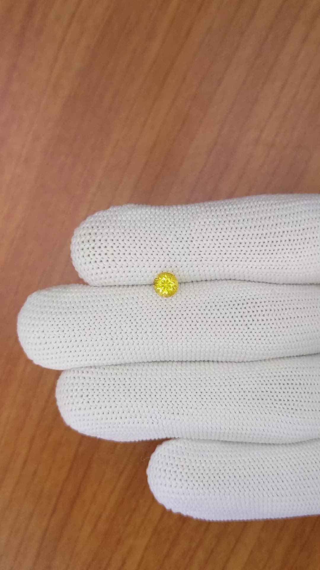 0.61 Ct. Orangish Yellow Sapphire from Ceylon (Sri Lanka) Size Video
