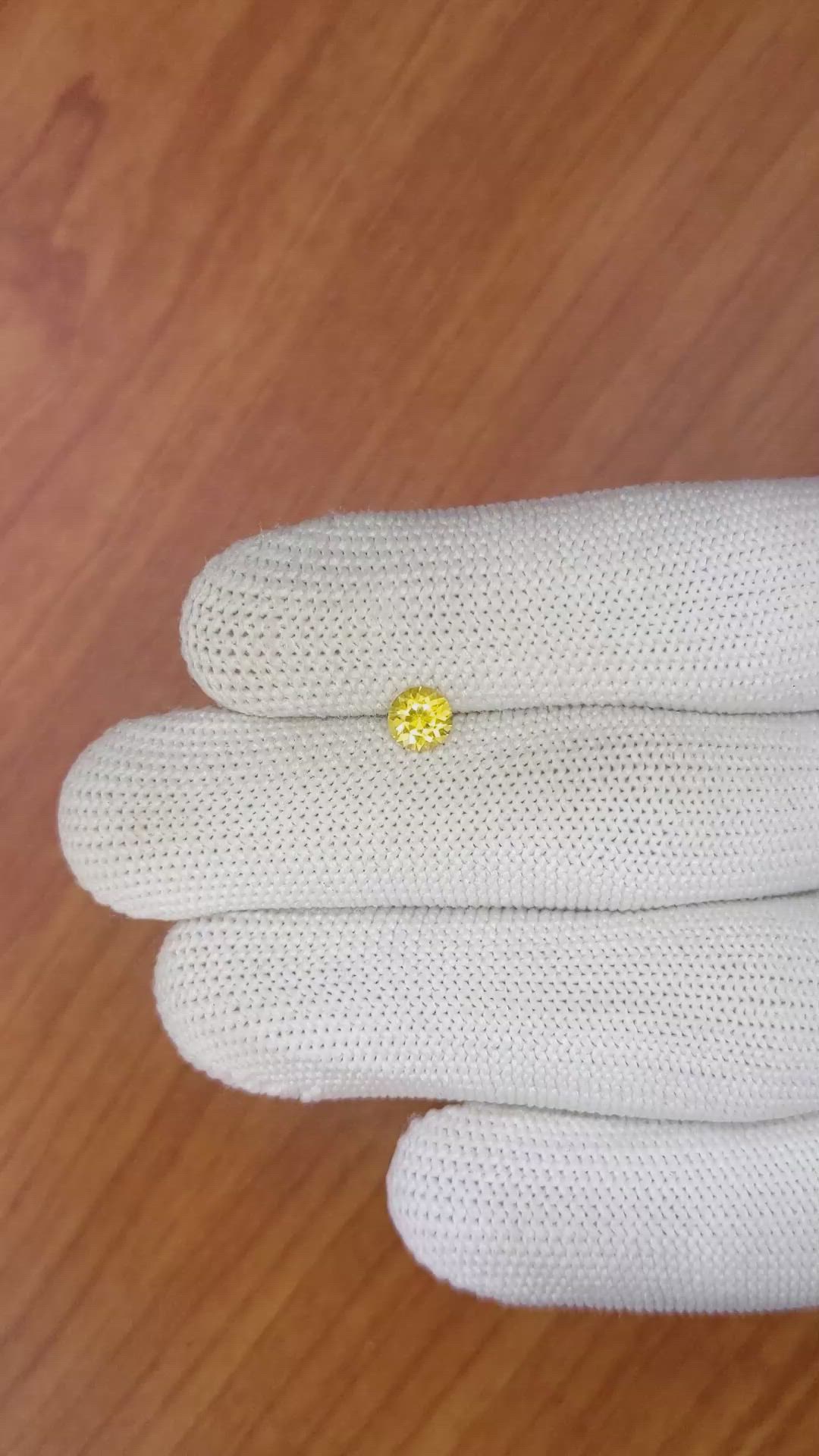 0.66 Ct. Orangish Yellow Sapphire from Ceylon (Sri Lanka) Size Video