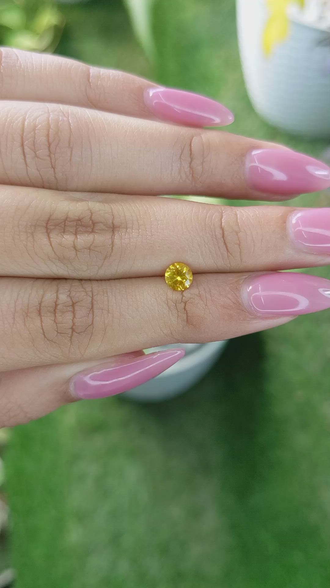 0.55 Ct. Orangish Yellow Sapphire from Ceylon (Sri Lanka) Size Video