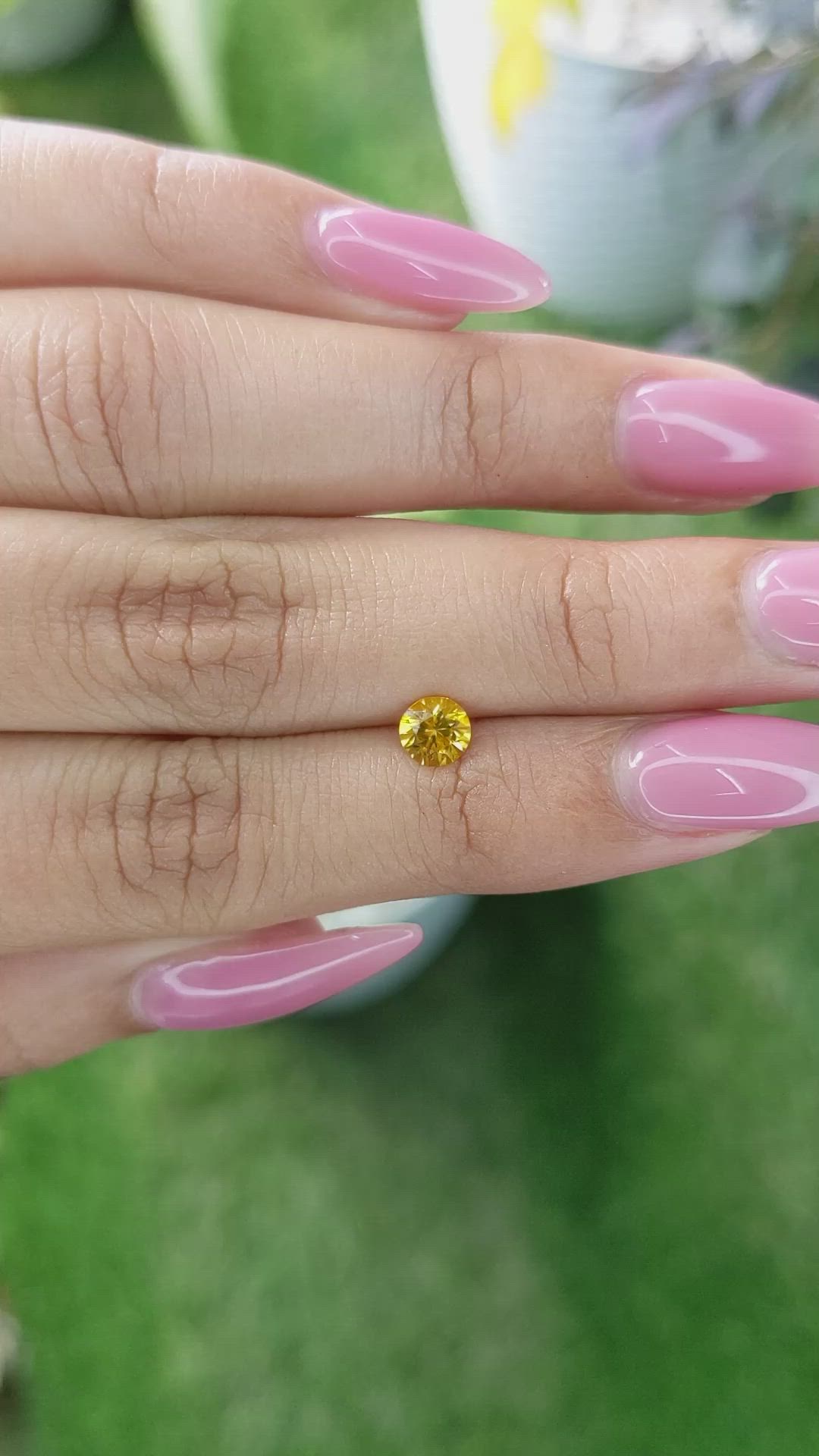 0.55 Ct. Orangish Yellow Sapphire from Ceylon (Sri Lanka) Size Video