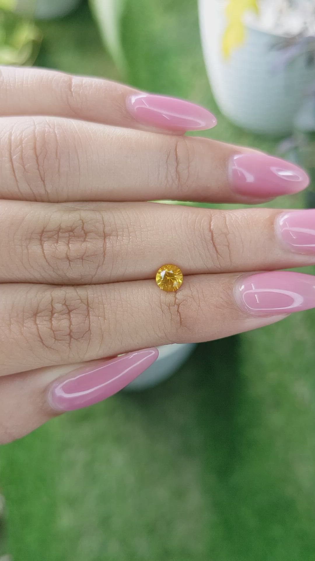 0.60 Ct. Yellowish Orange Sapphire from Ceylon (Sri Lanka) Size Video