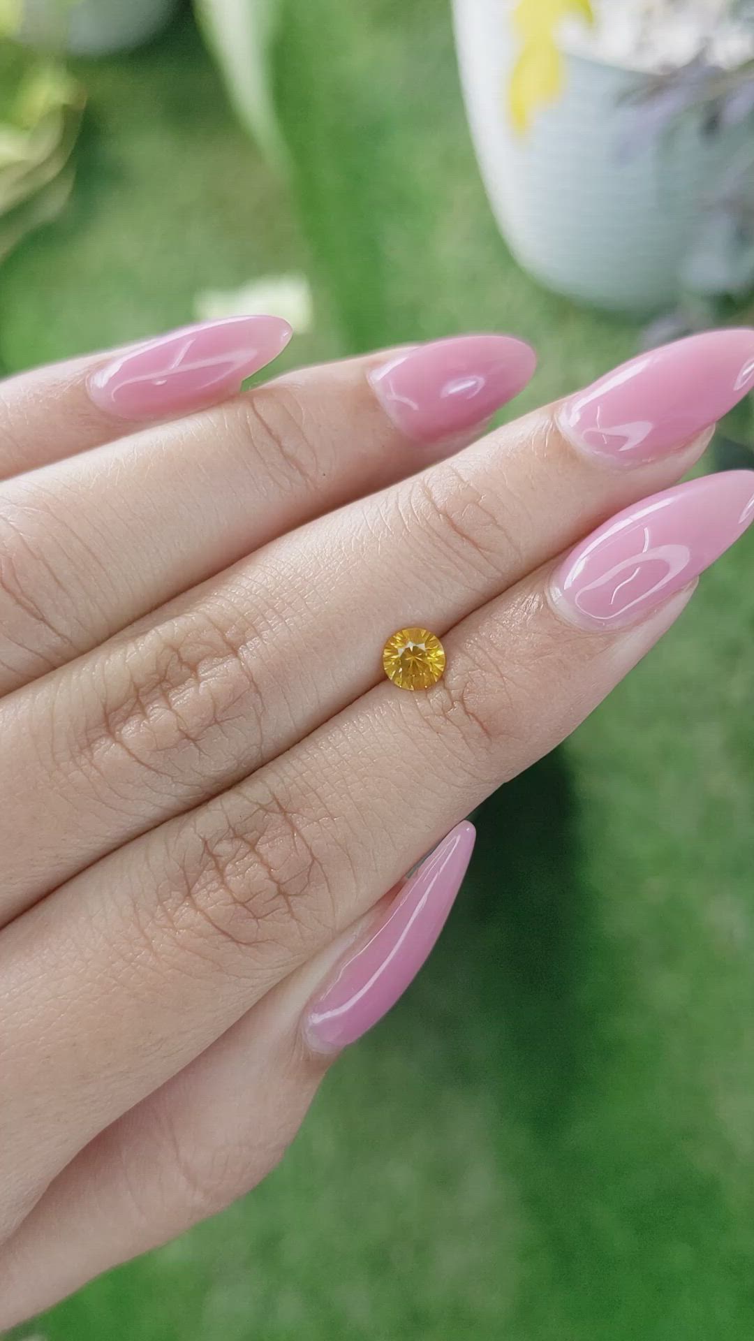 0.60 Ct. Yellowish Orange Sapphire from Ceylon (Sri Lanka) Size Video