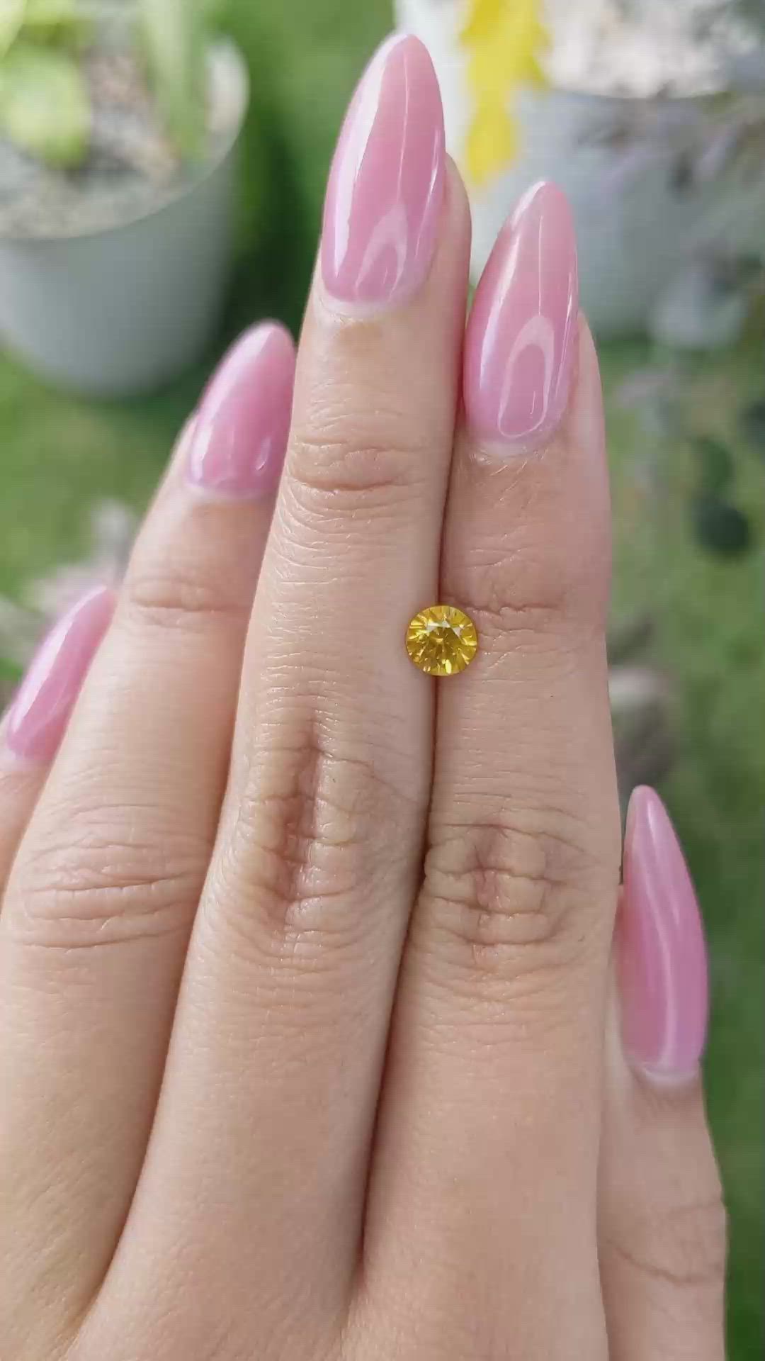 0.68 Ct. Yellowish Orange Sapphire from Ceylon (Sri Lanka) Size Video