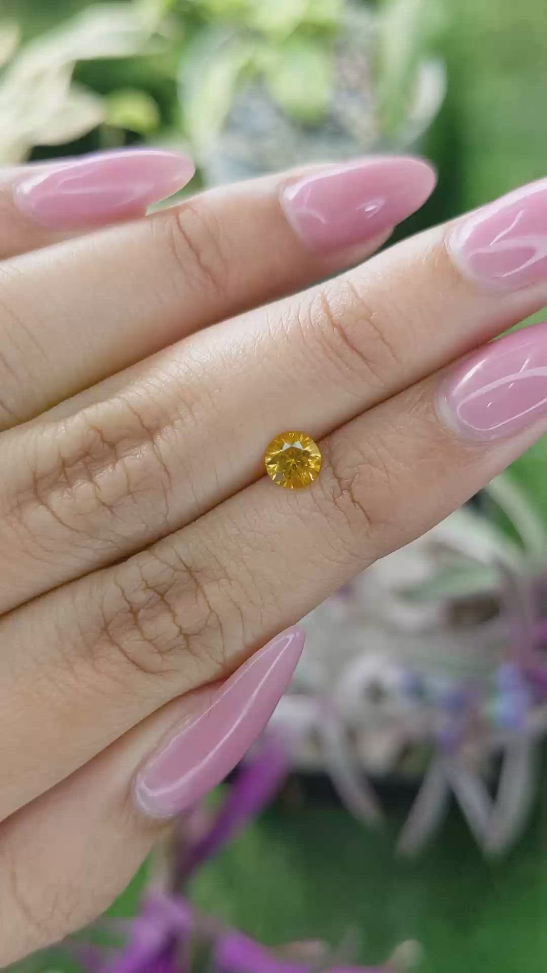 0.60 Ct. Yellowish Orange Sapphire from Ceylon (Sri Lanka) Size Video