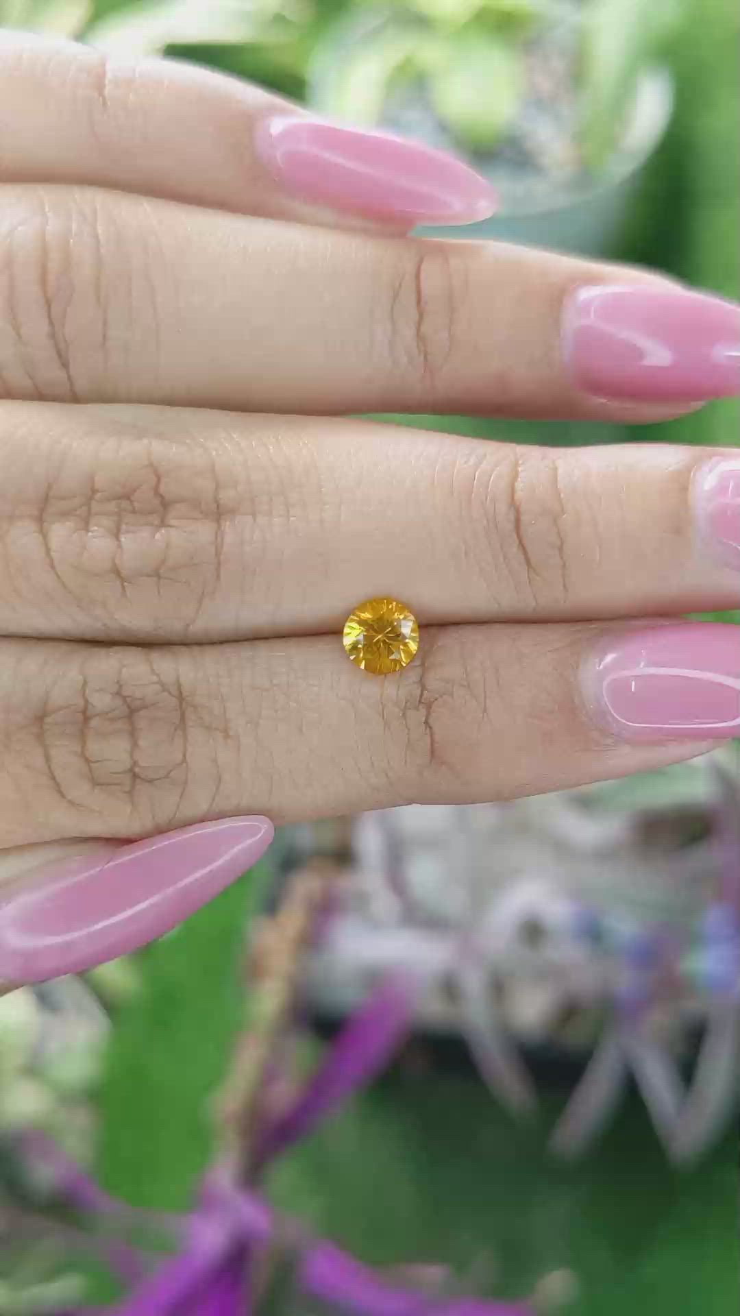0.60 Ct. Yellowish Orange Sapphire from Ceylon (Sri Lanka) Size Video