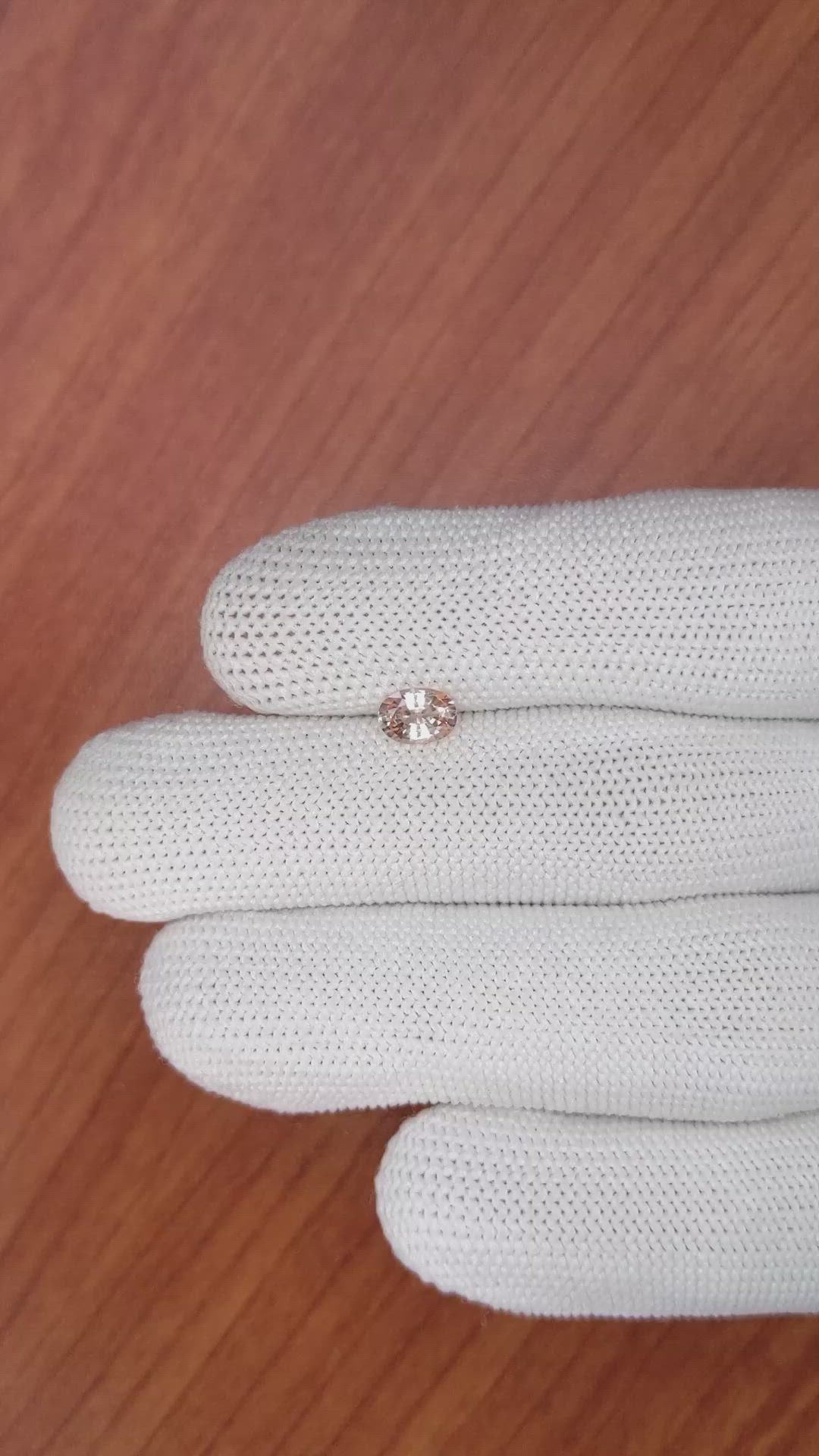 0.70 Ct. Peach Sapphire from Ceylon (Sri Lanka) Size Video