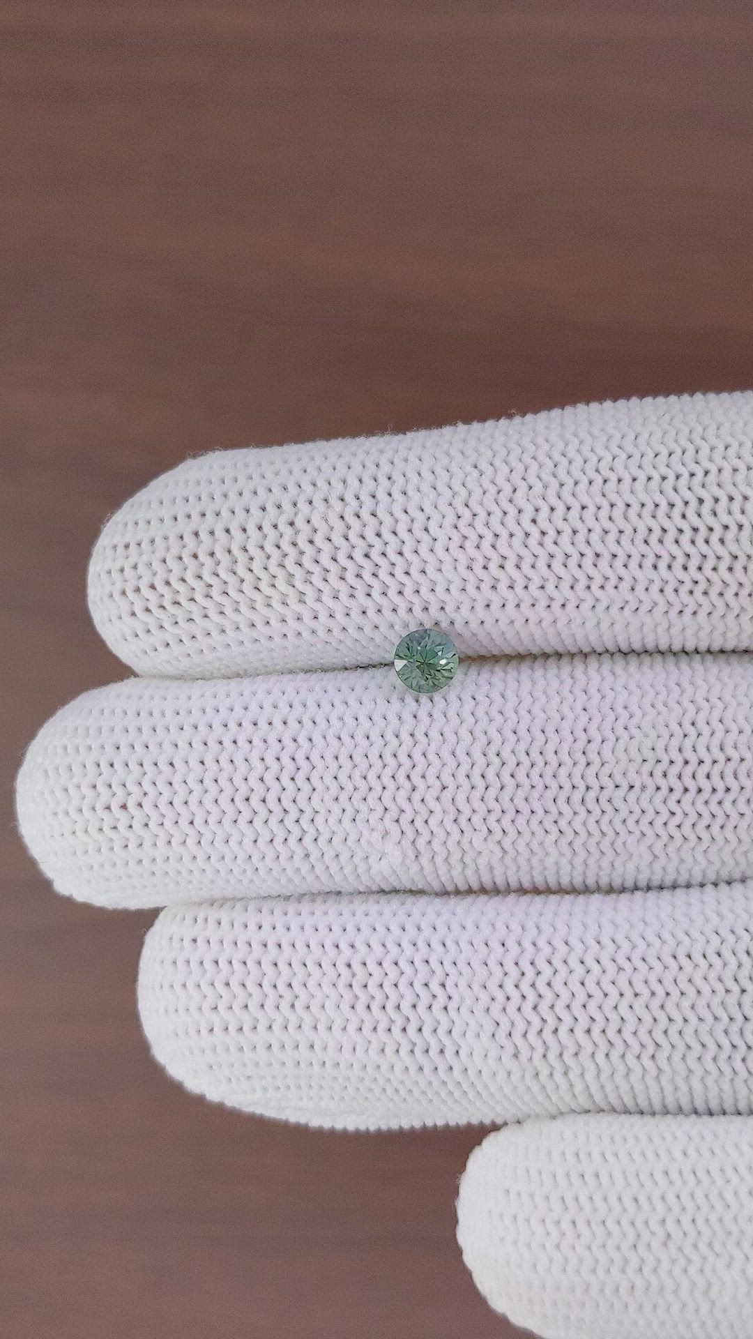 0.61 Ct. Bluish Green Sapphire from Madagascar Size Video